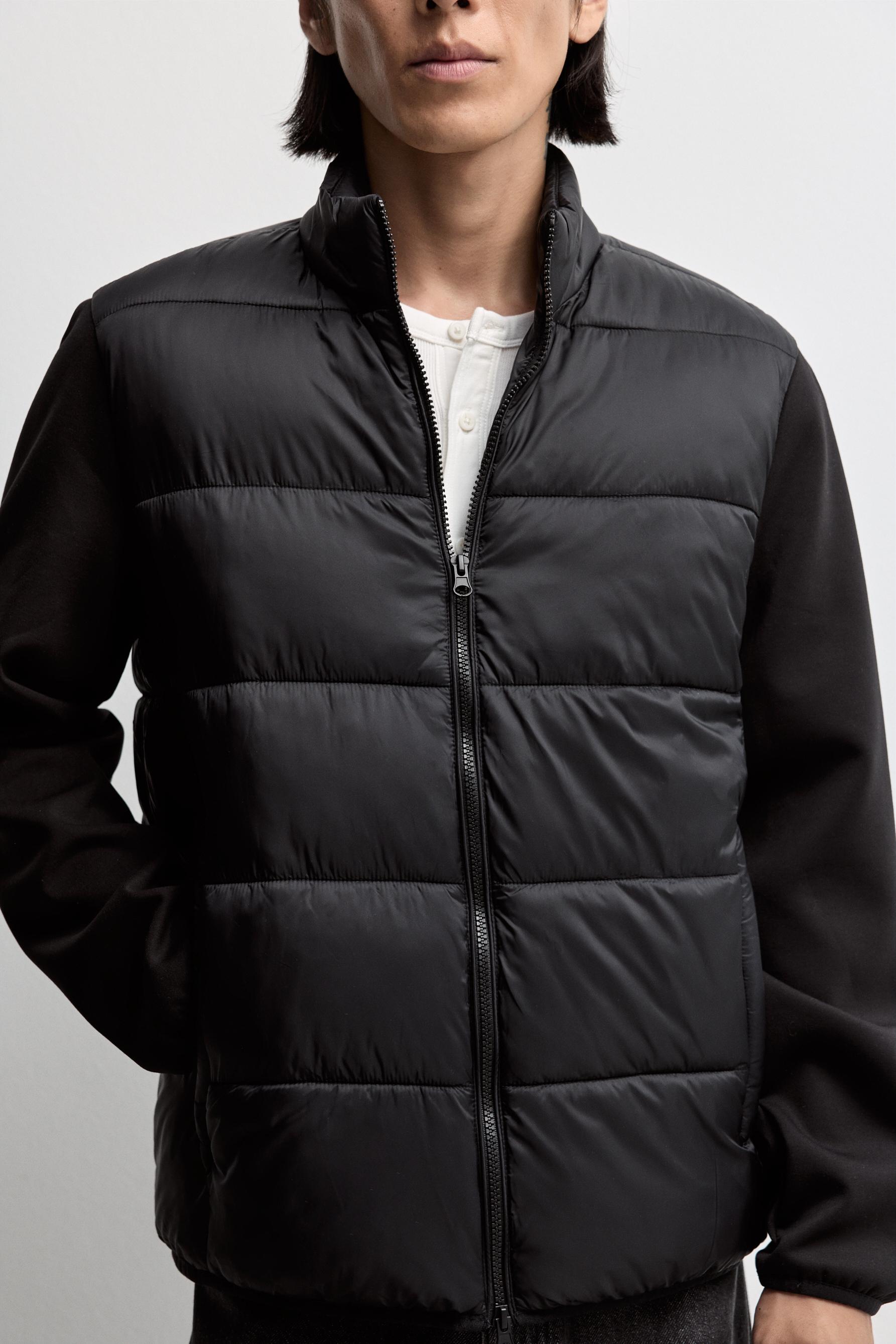 Quilted jacket with interlock sleeves — BLACK