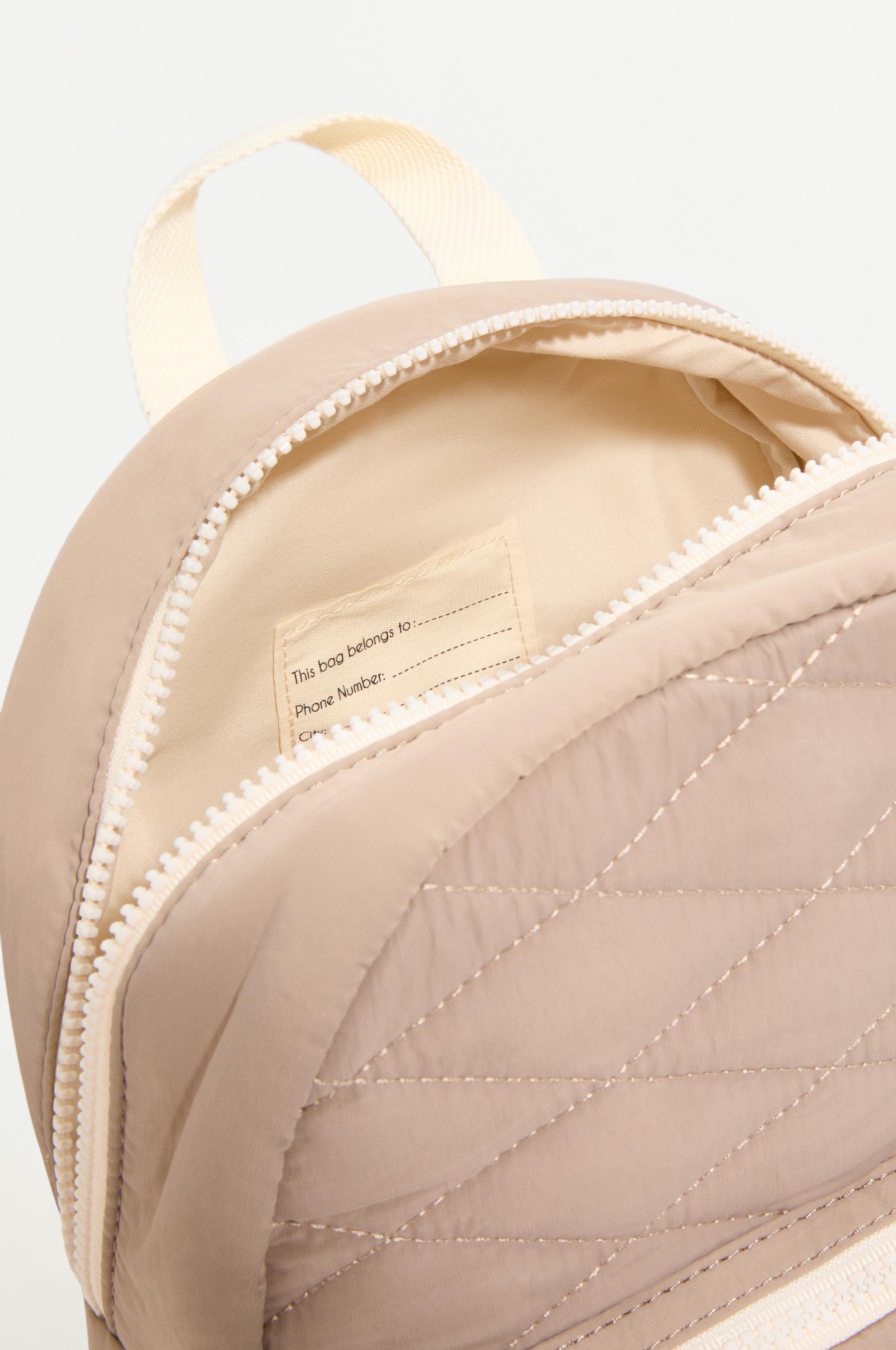 QUILTED BACKPACK — BROWN