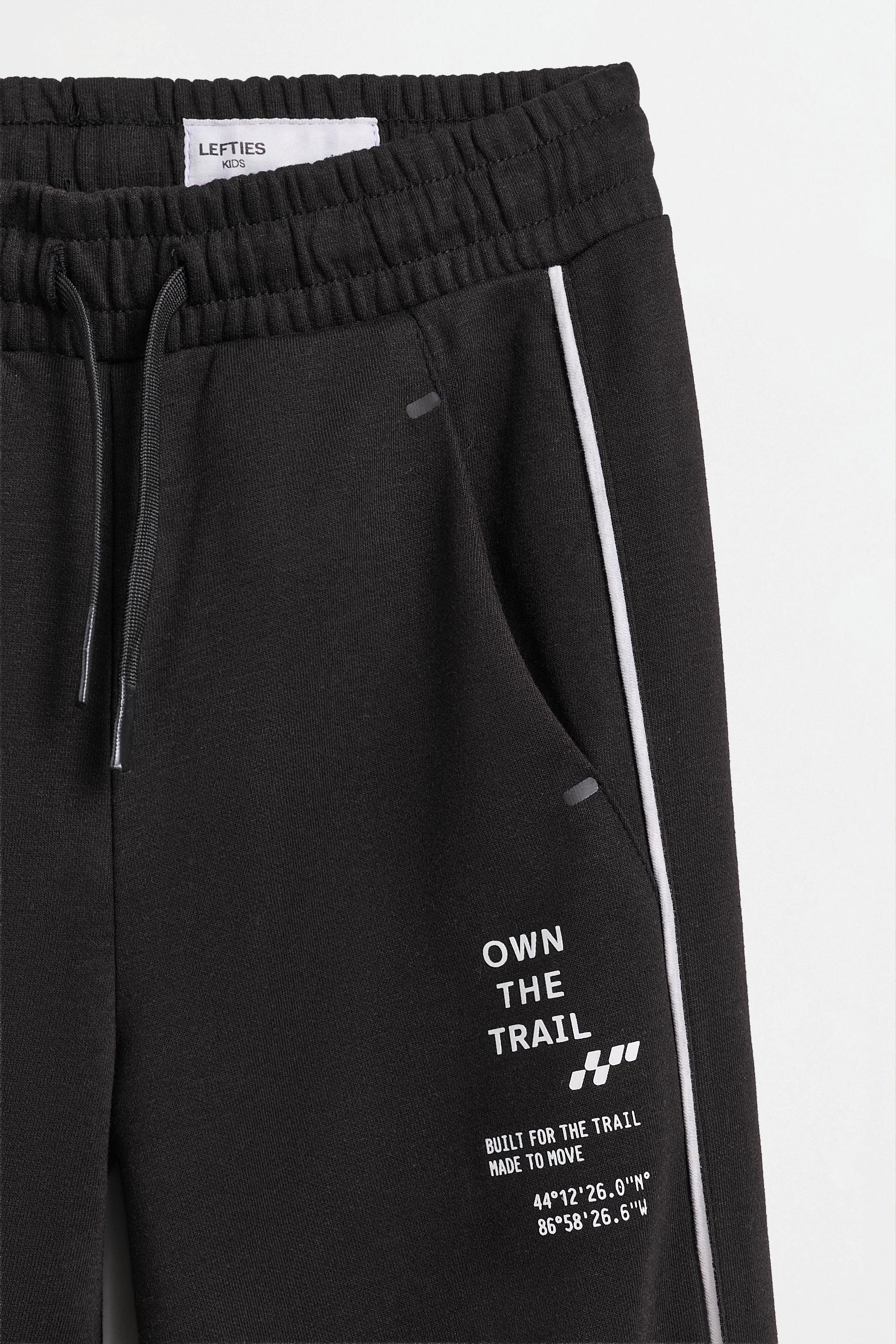 Interlock joggers with contrast piping — BLACK