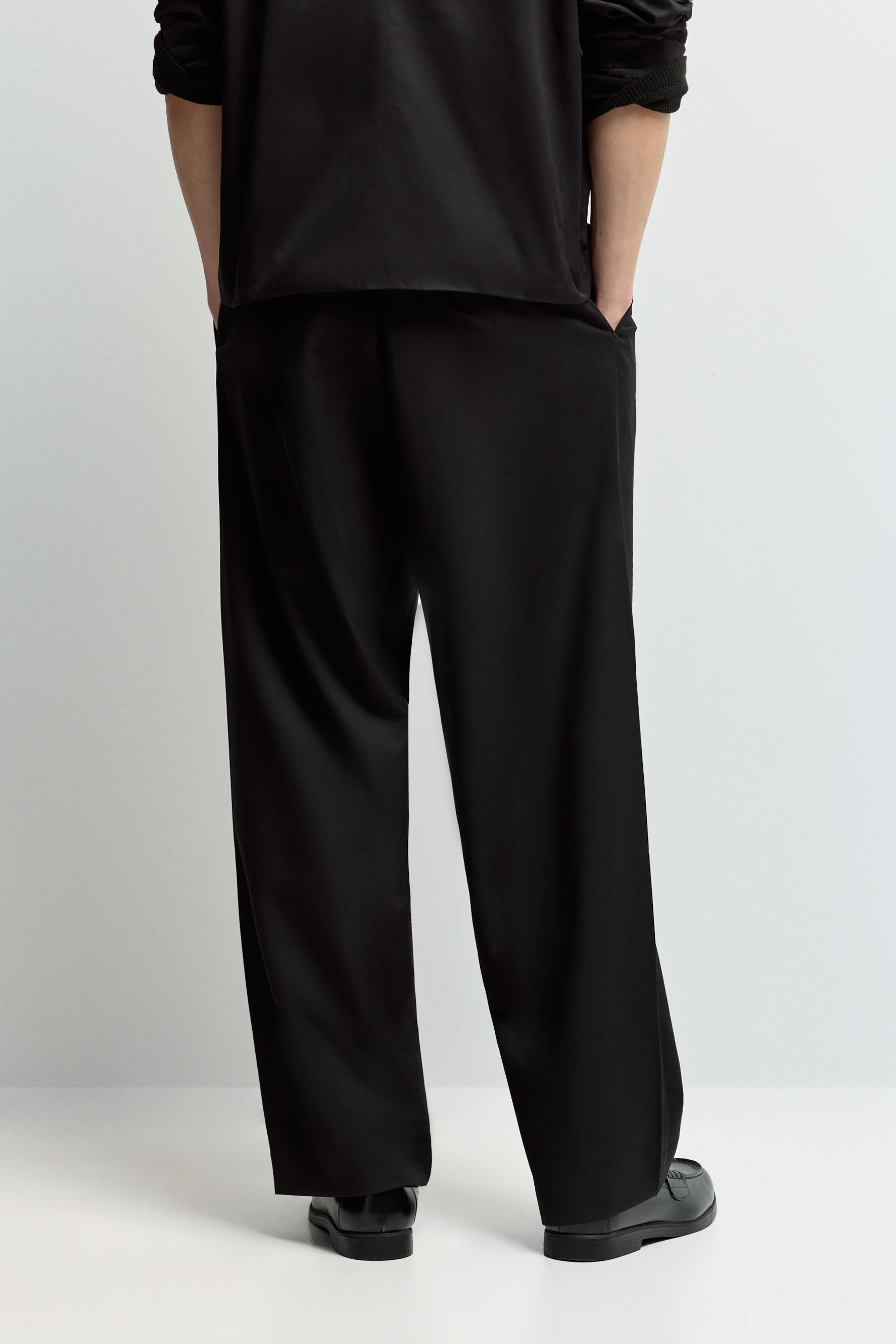 Baggy trousers with darts — BLACK