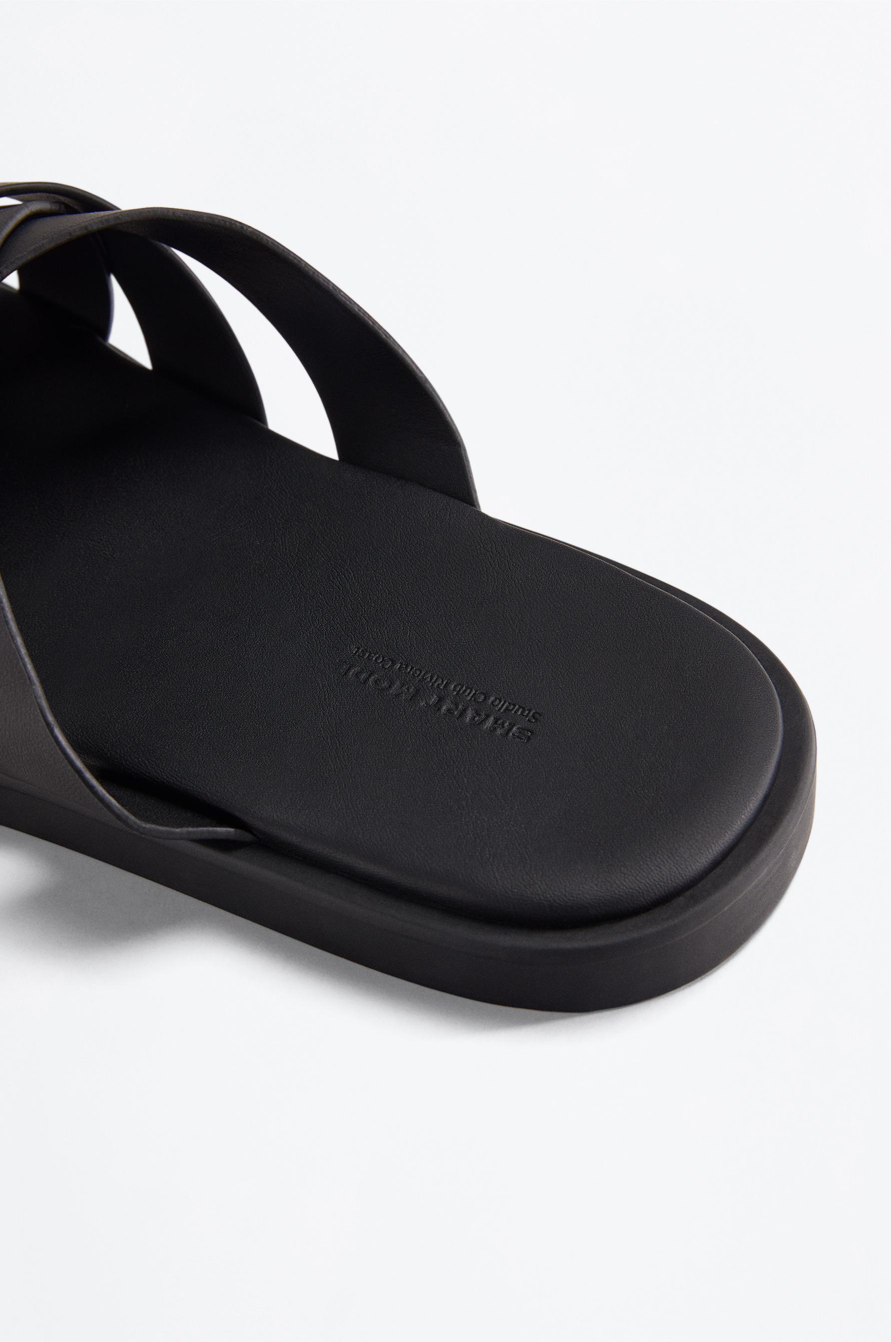 Cross-strap sandals — BLACK