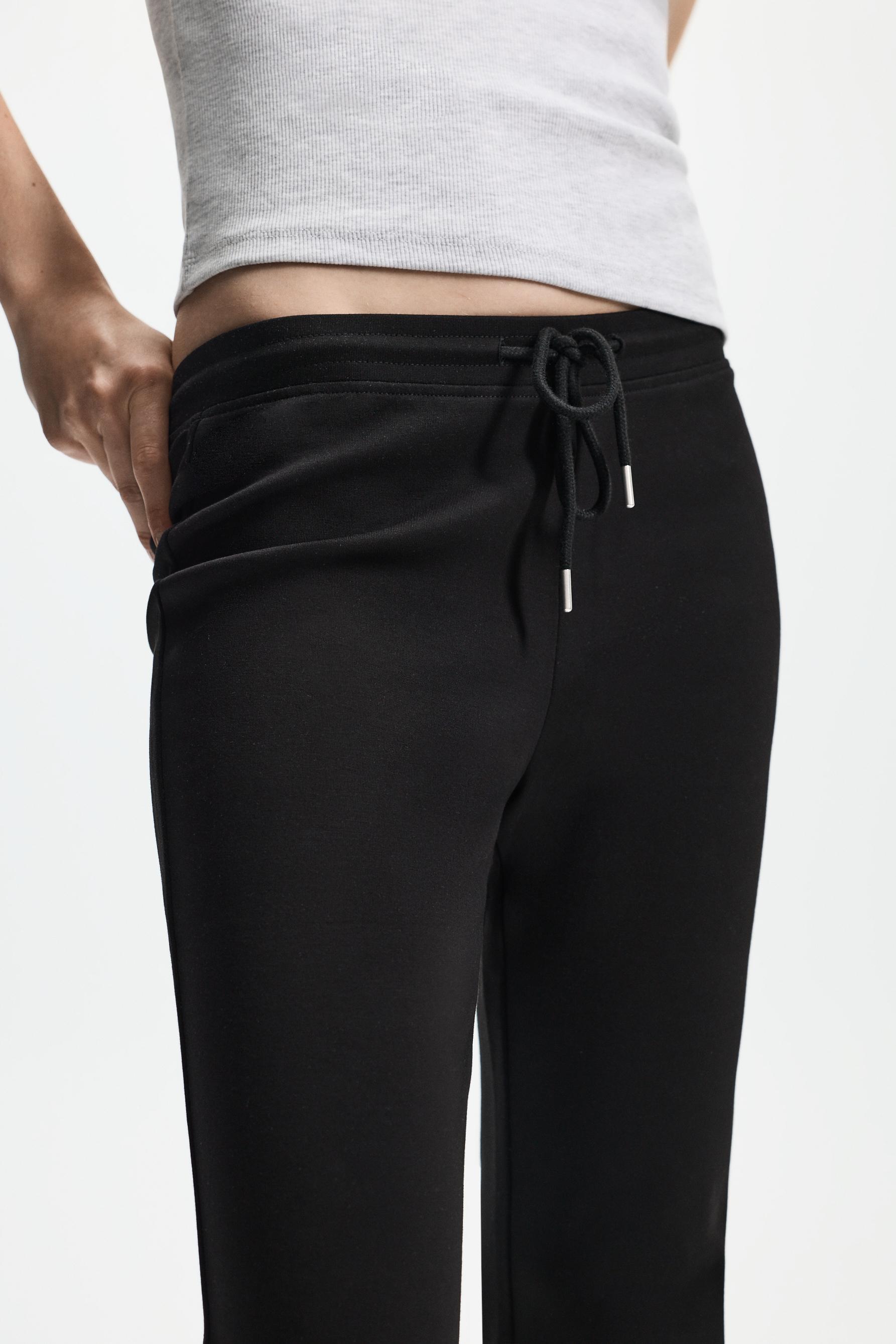 Basic interlock bell bottom trousers — BLACK
