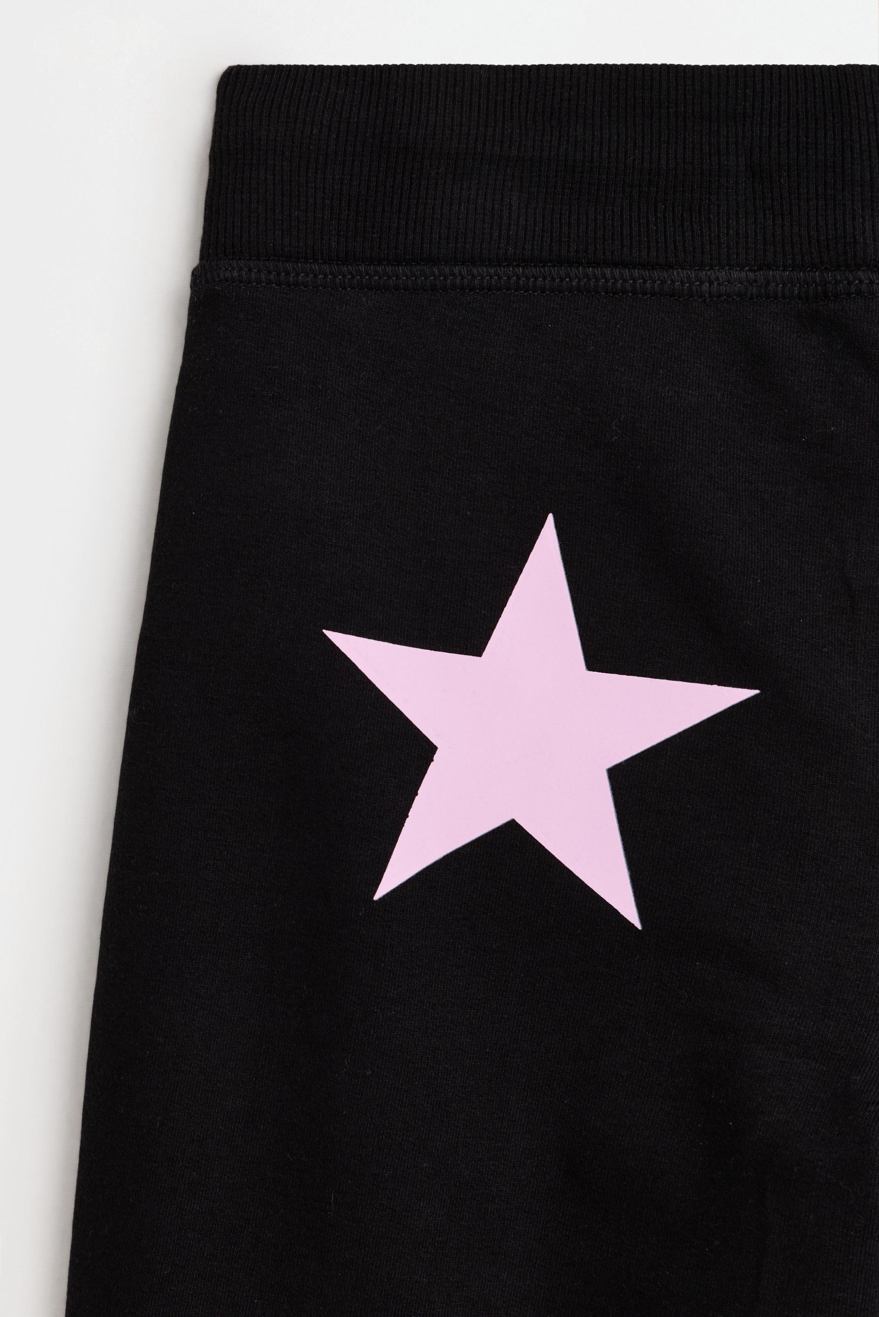 Star print fleece bell bottom leggings — BLACK