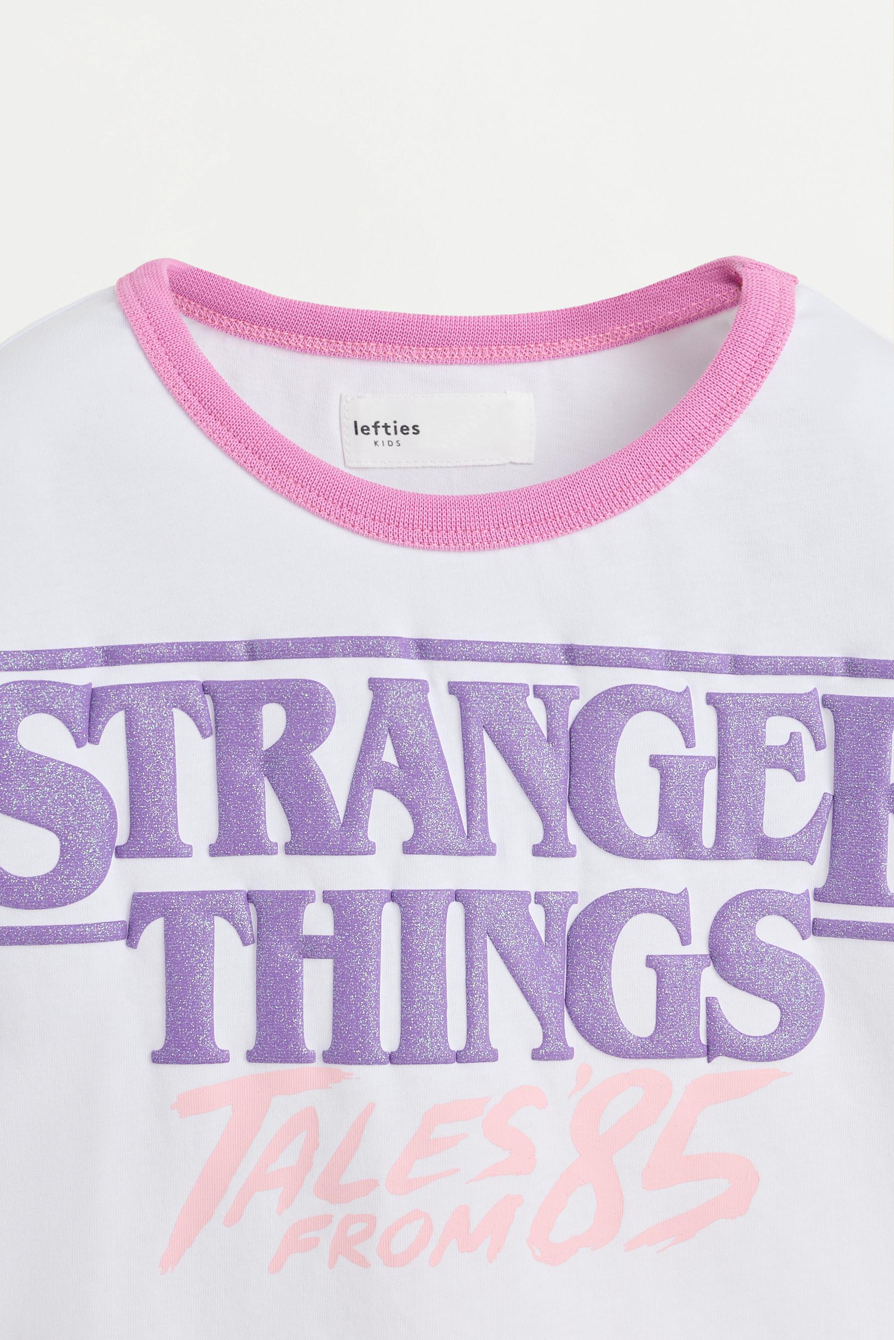 Stranger Things™/© Netflix shimmery text T-shirt — WHITE