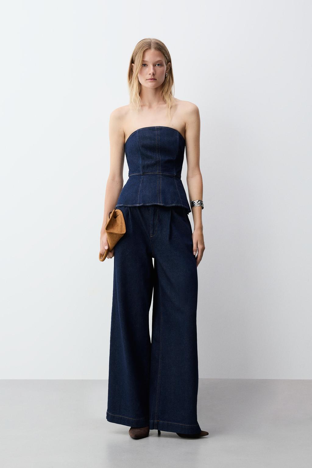 Jeans gamba larga con pieghe