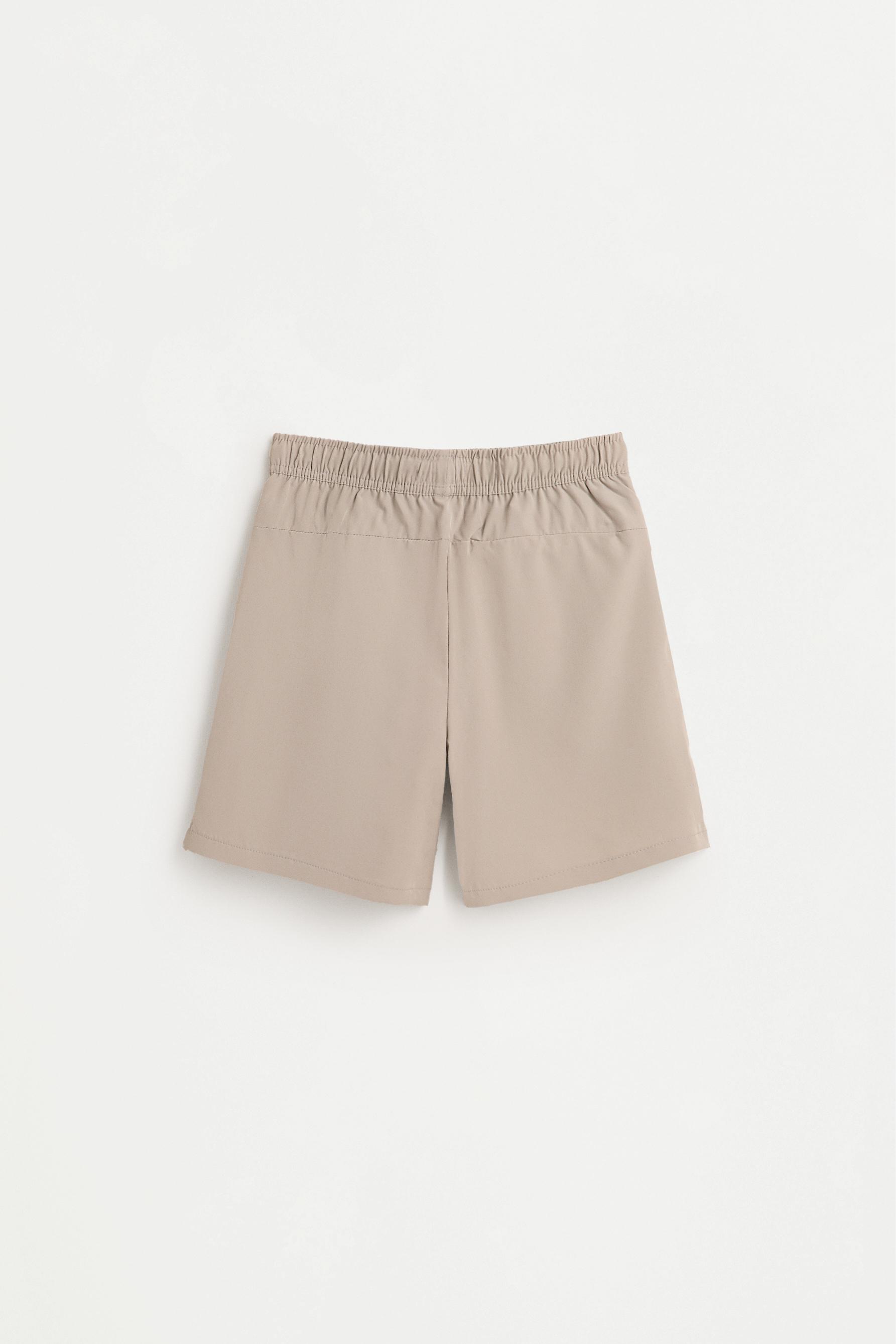 Bermuda sports shorts — SAND
