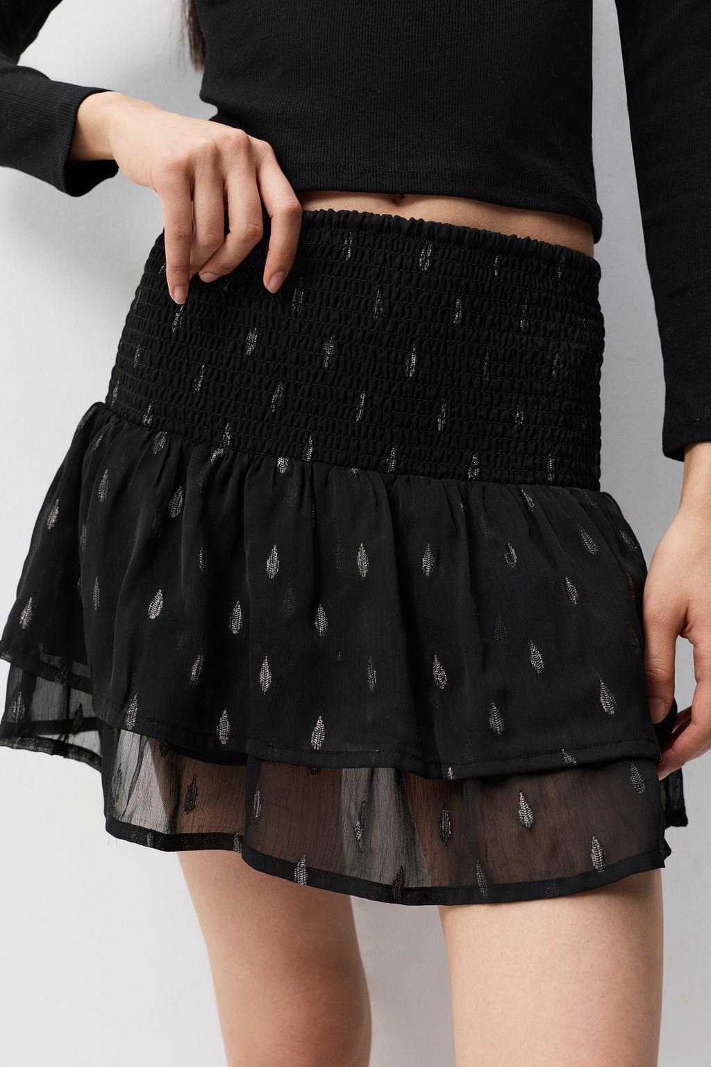 Faldilla volants detalls metal·litzats