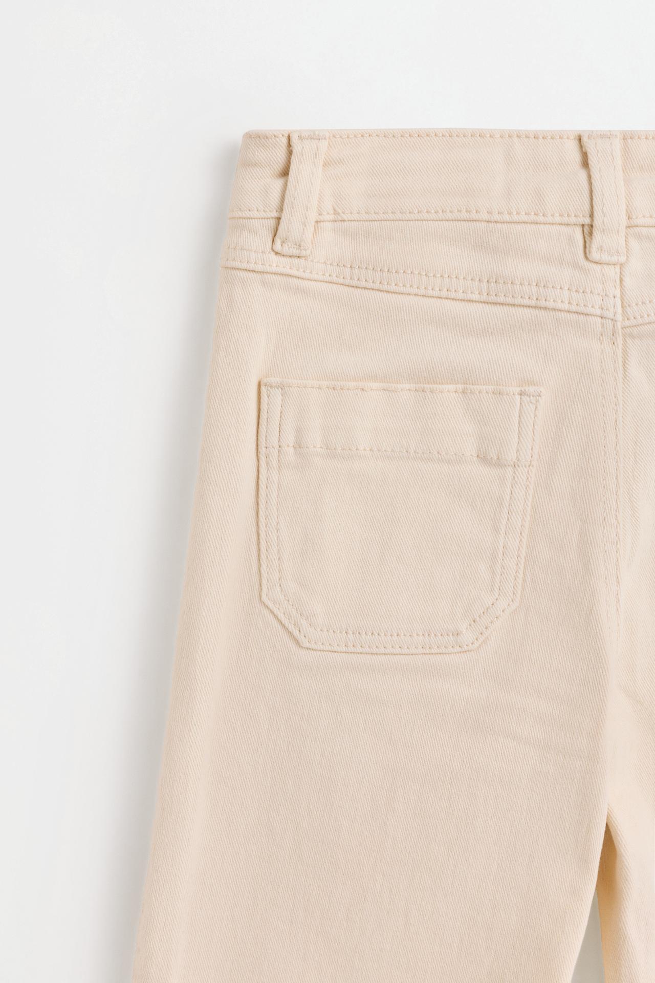 Embroidered bell bottom trousers — BEIGE