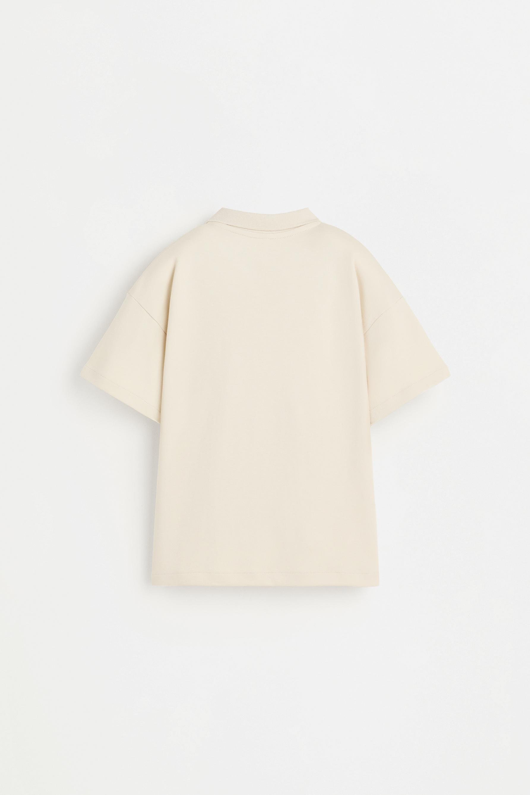 Interlock polo shirt with text — ECRU