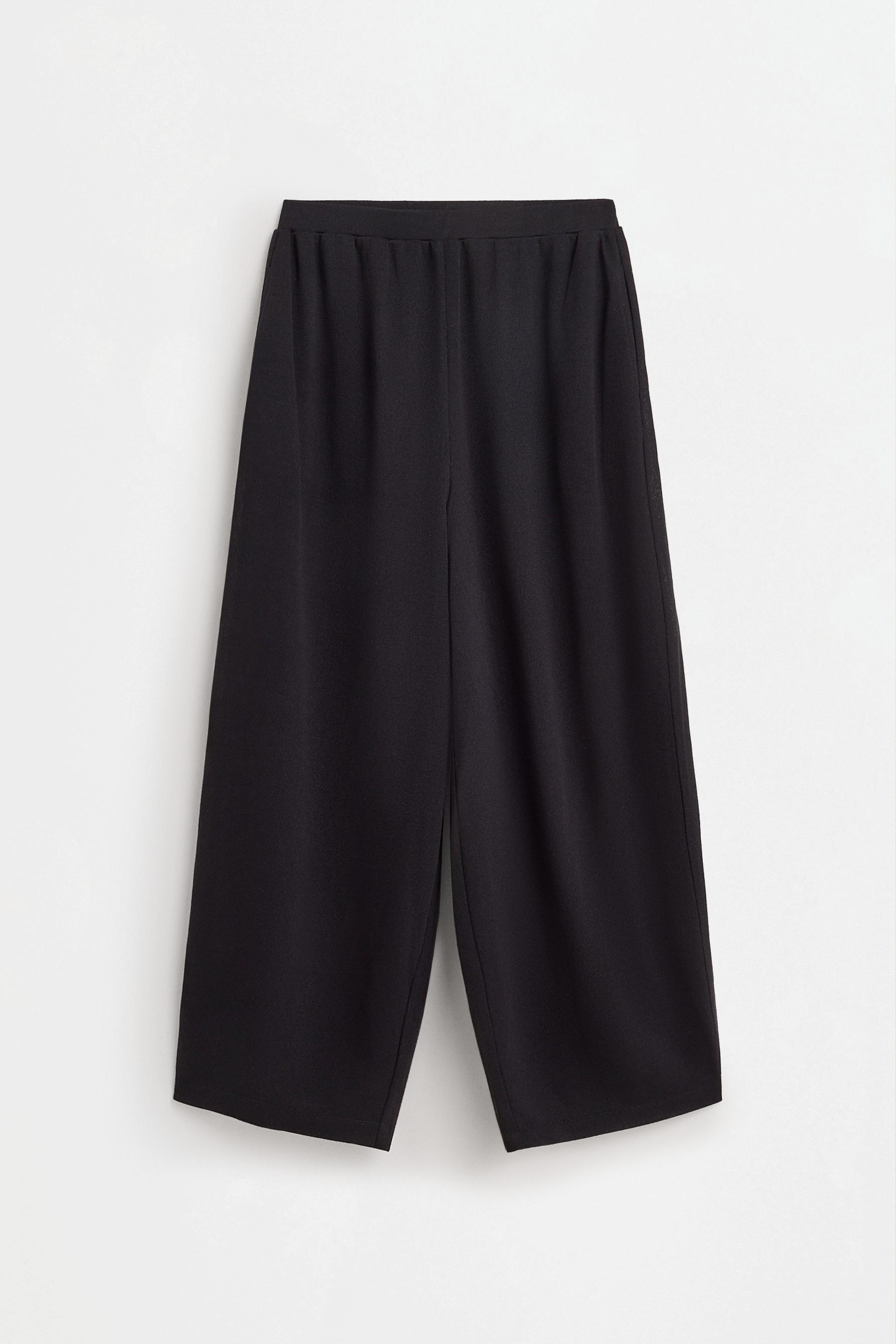 Flowing carrot fit trousers — BLACK