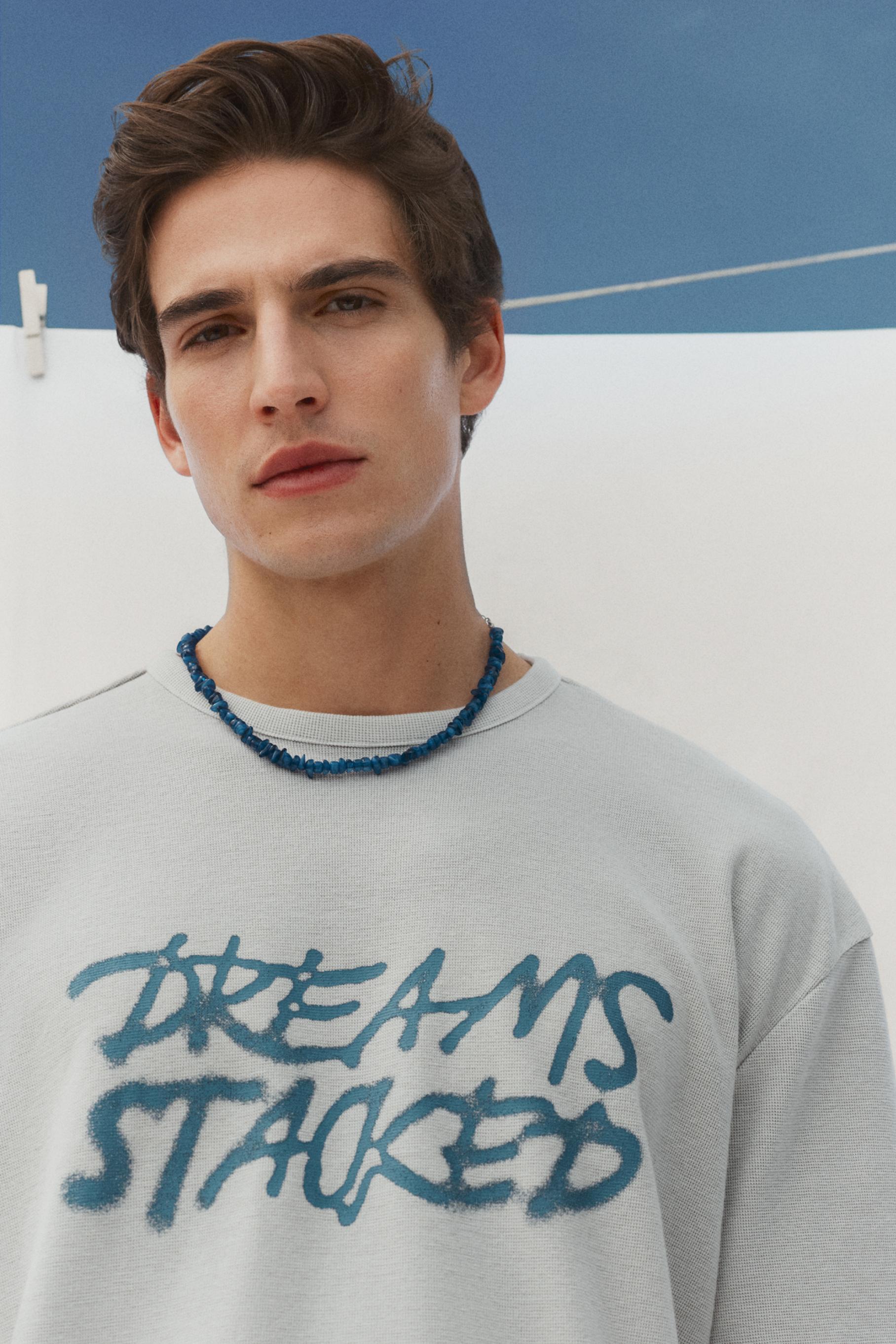 Faded-effect slogan T-shirt — STEEL
