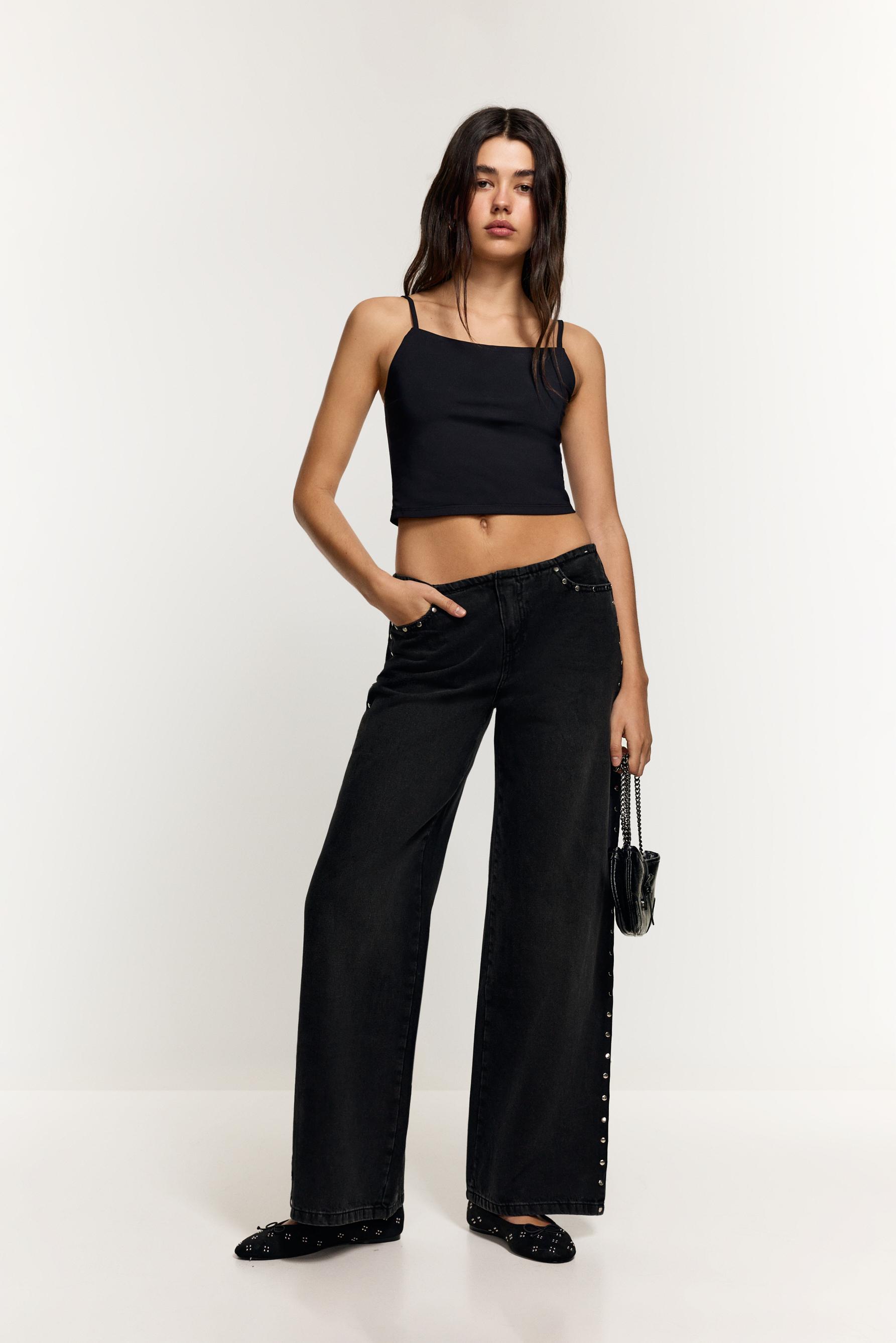 Jeans wide leg sin cintura tachas
