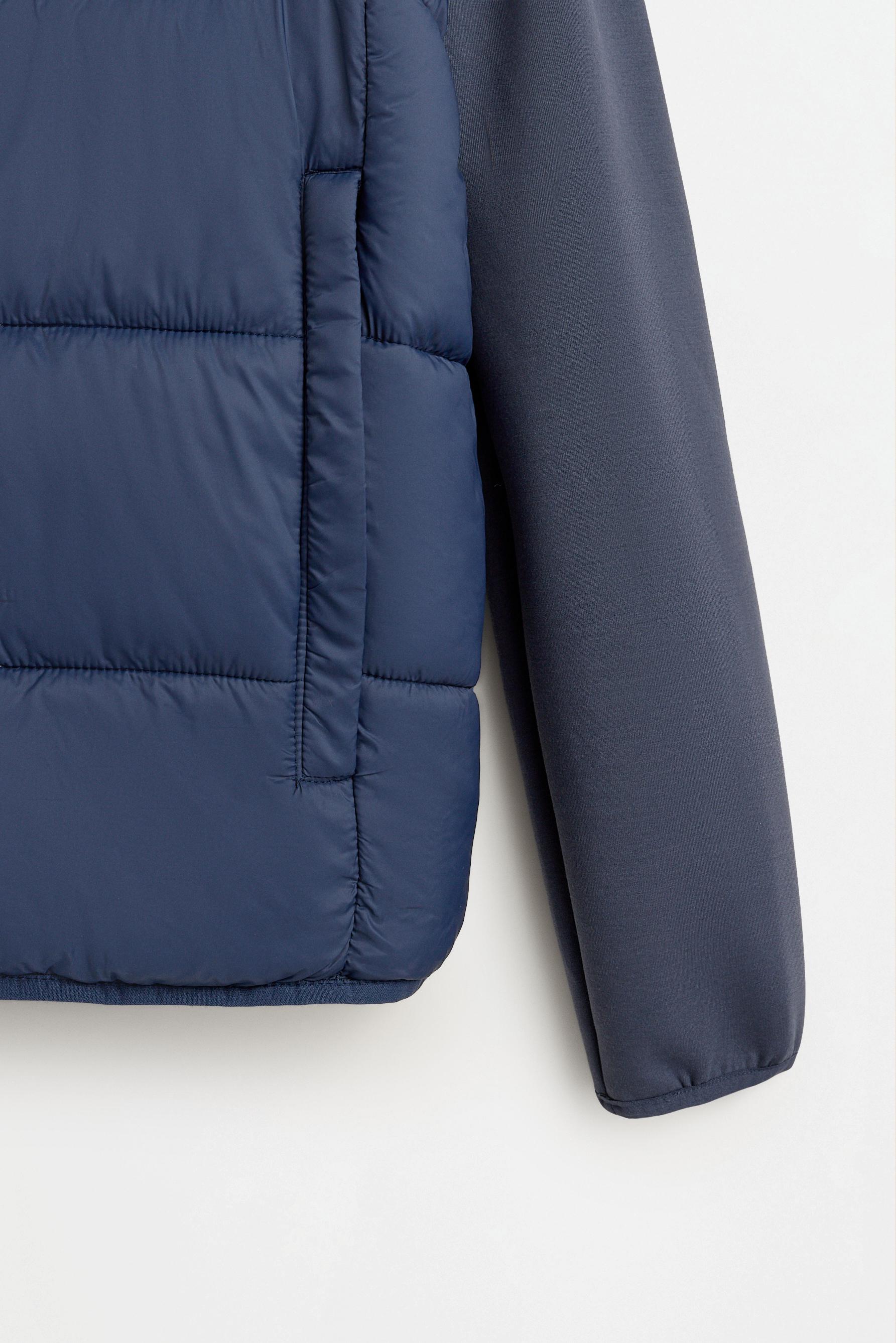 Quilted jacket with interlock sleeves — BLUE