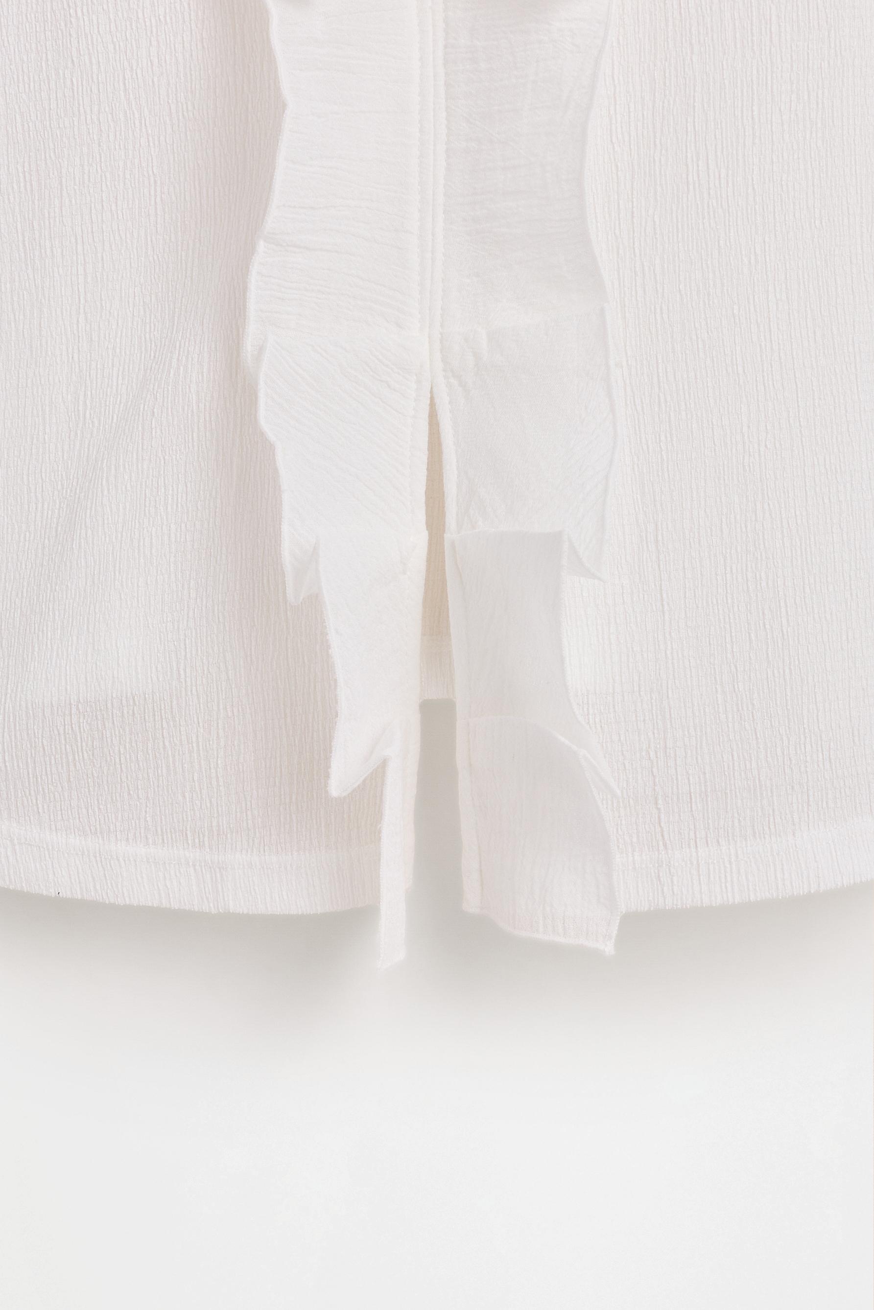 Ruffled top — OFF WHITE