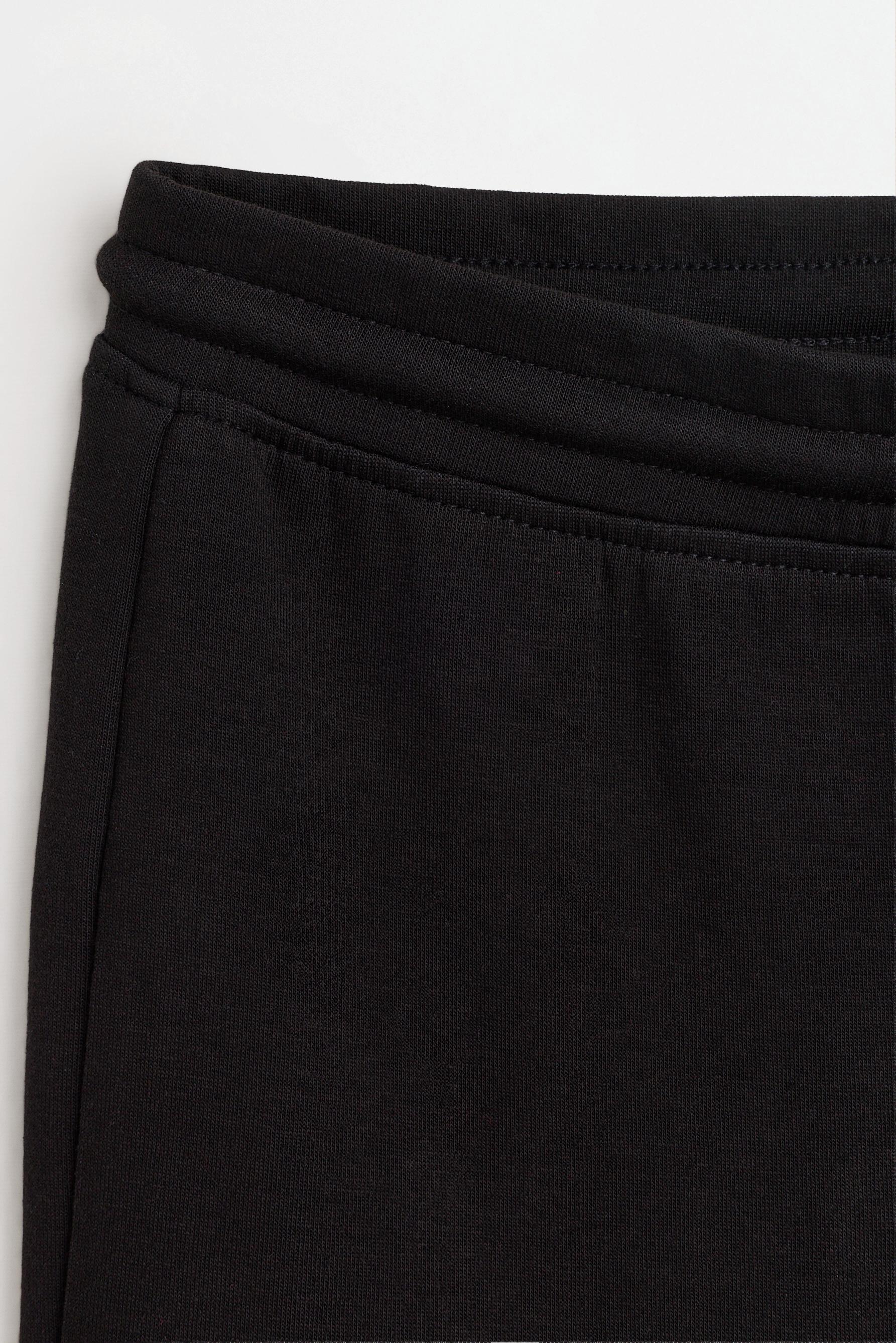 Basic interlock bell bottom trousers — BLACK
