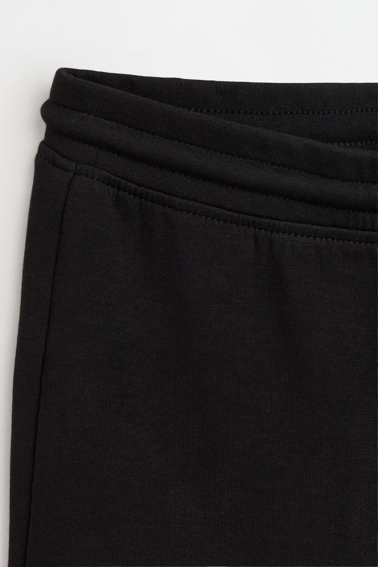 Basic interlock bell bottom trousers — BLACK
