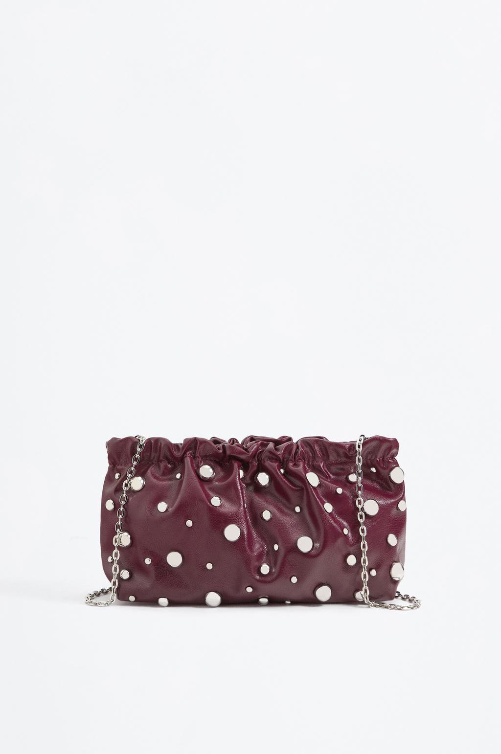 Bolso Pouch tachas