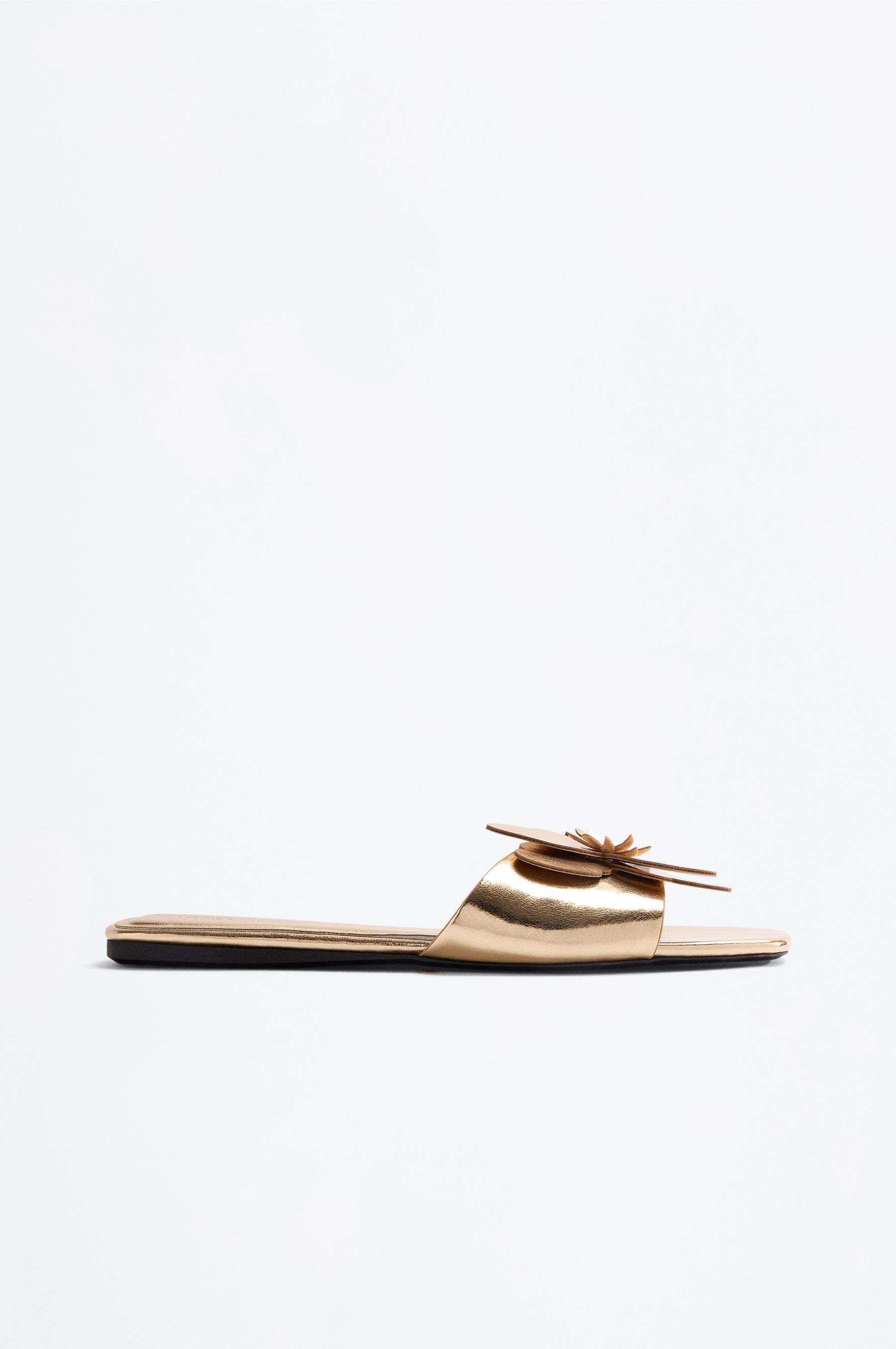 Flat slider sandals with flower detail — GOLD
