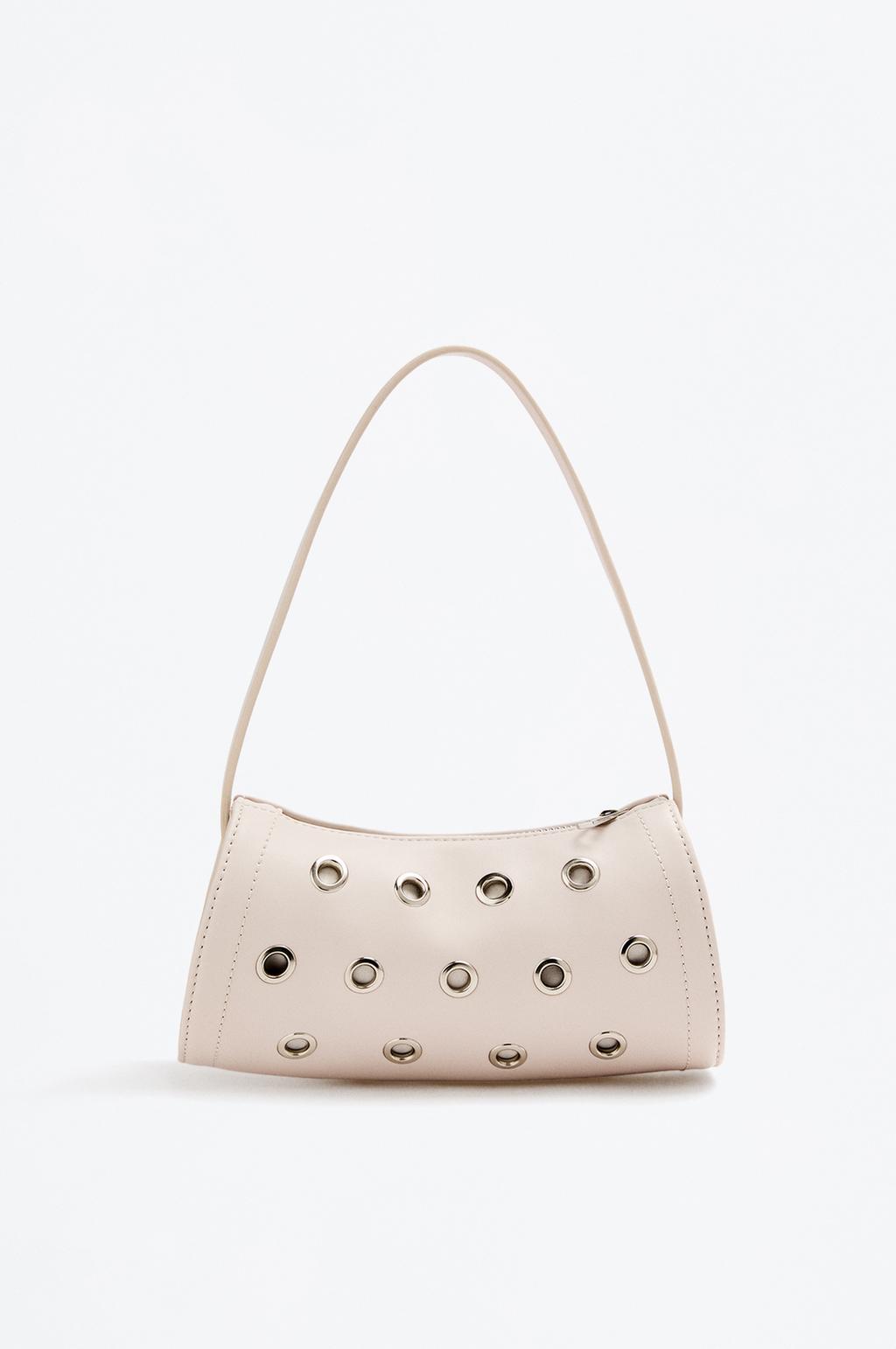 Bolsa de ombro com ilhós