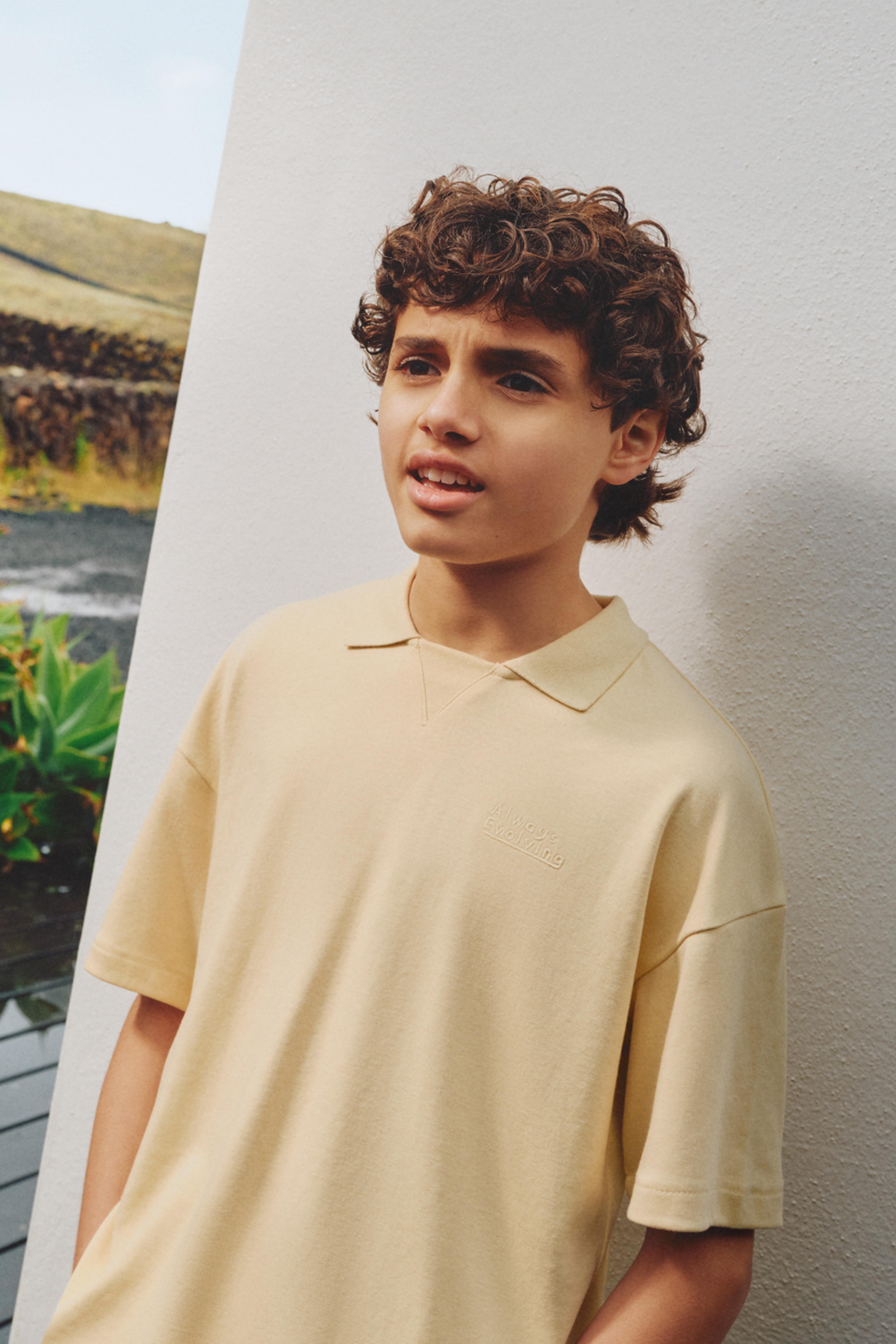 Interlock polo shirt with text — VANILLA