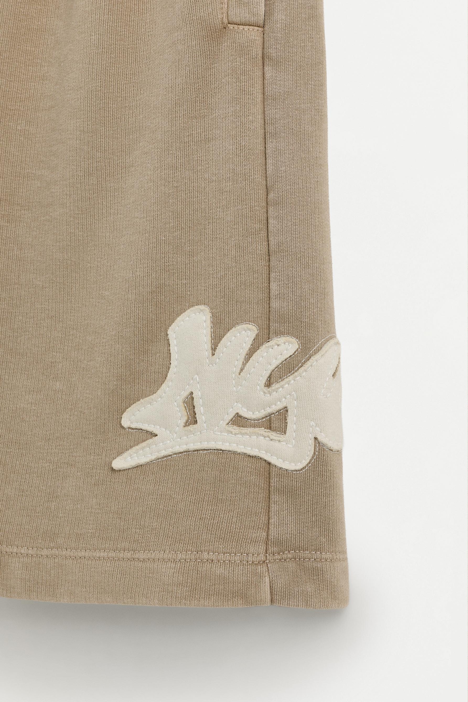 Plush Bermuda shorts with patch — OCHRE