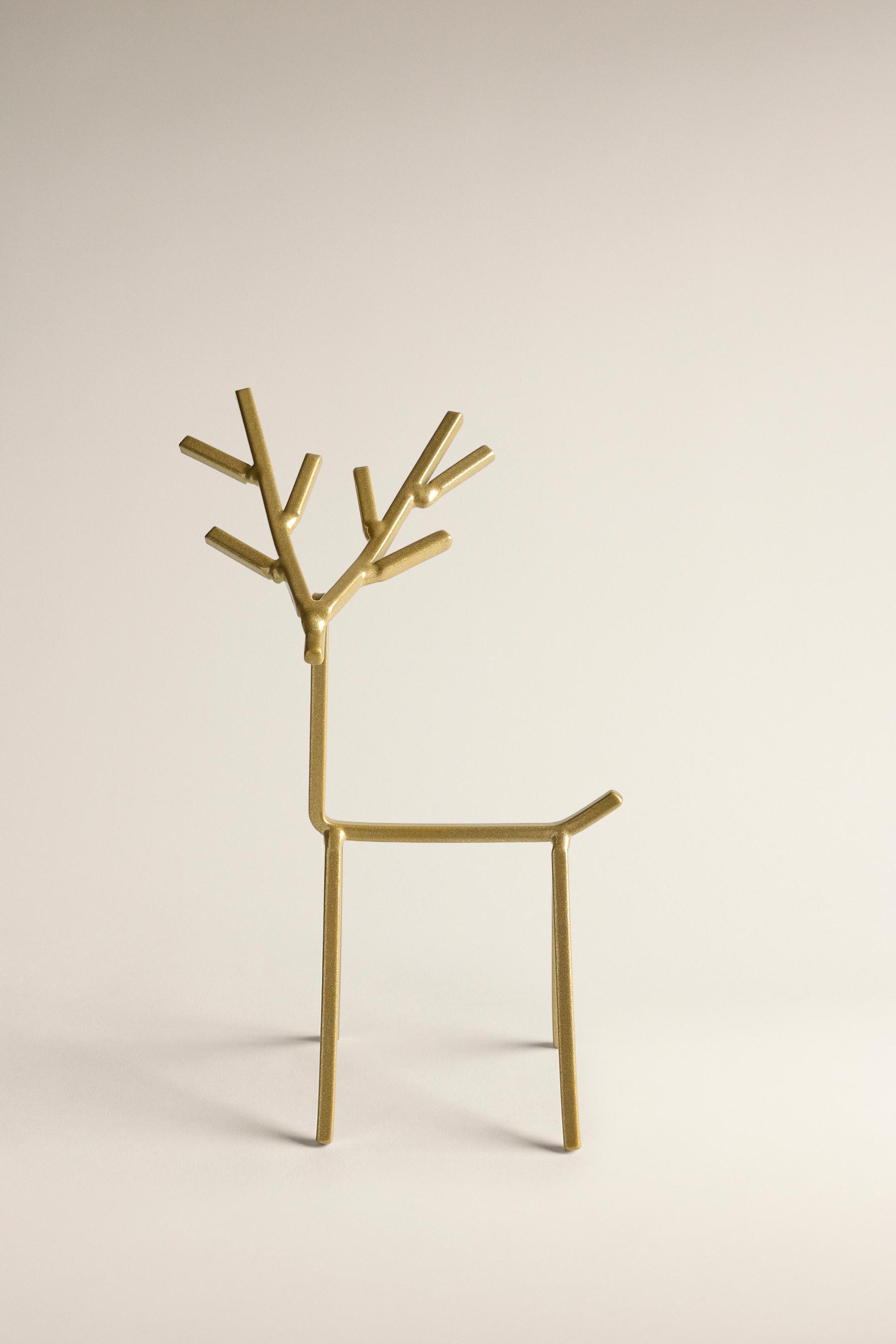 Figura decorativa reno dorado