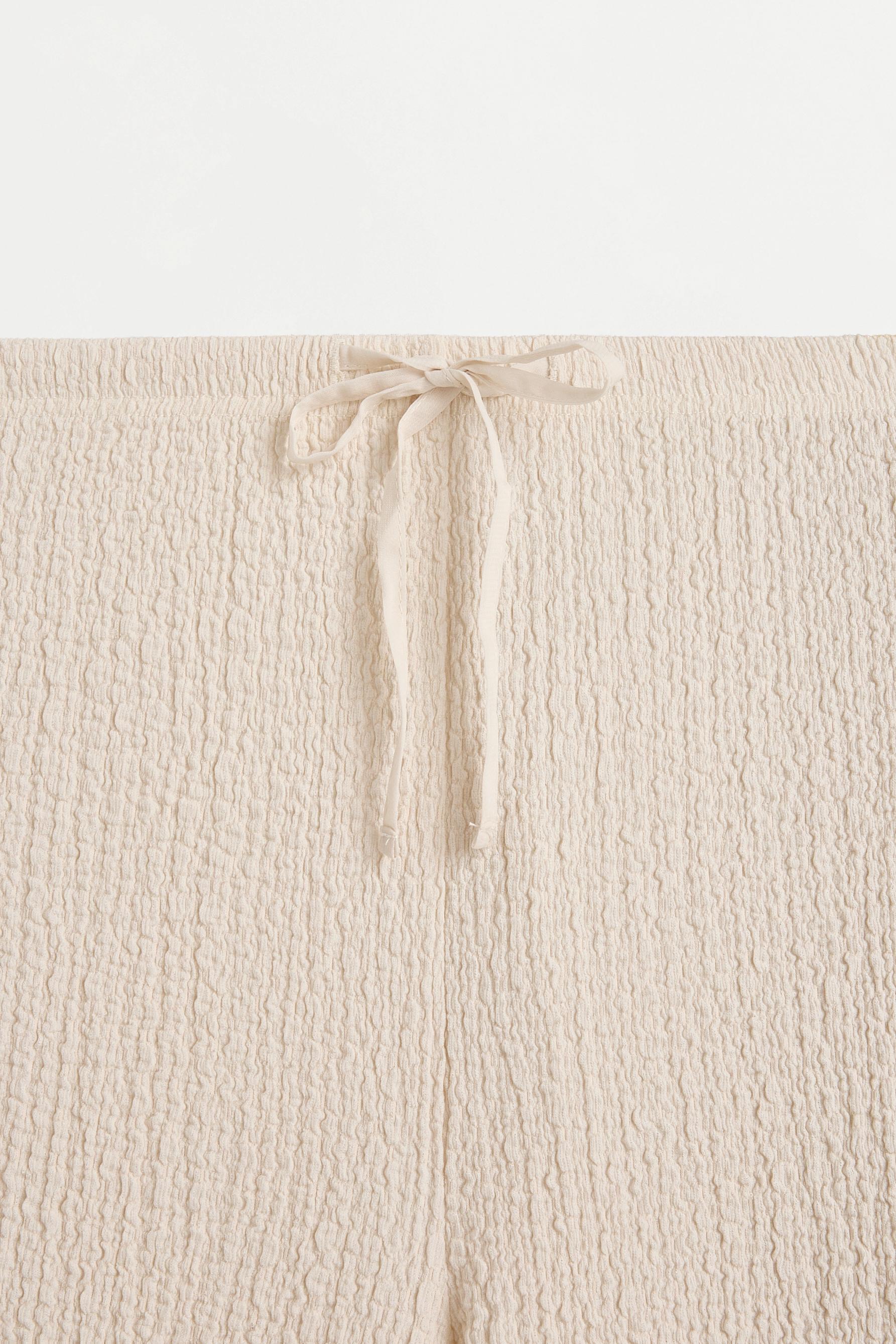 Textured wide-leg trousers — OFF WHITE