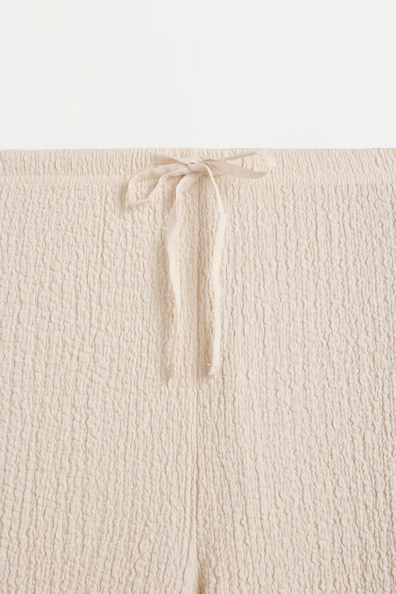 Textured wide-leg trousers — OFF WHITE