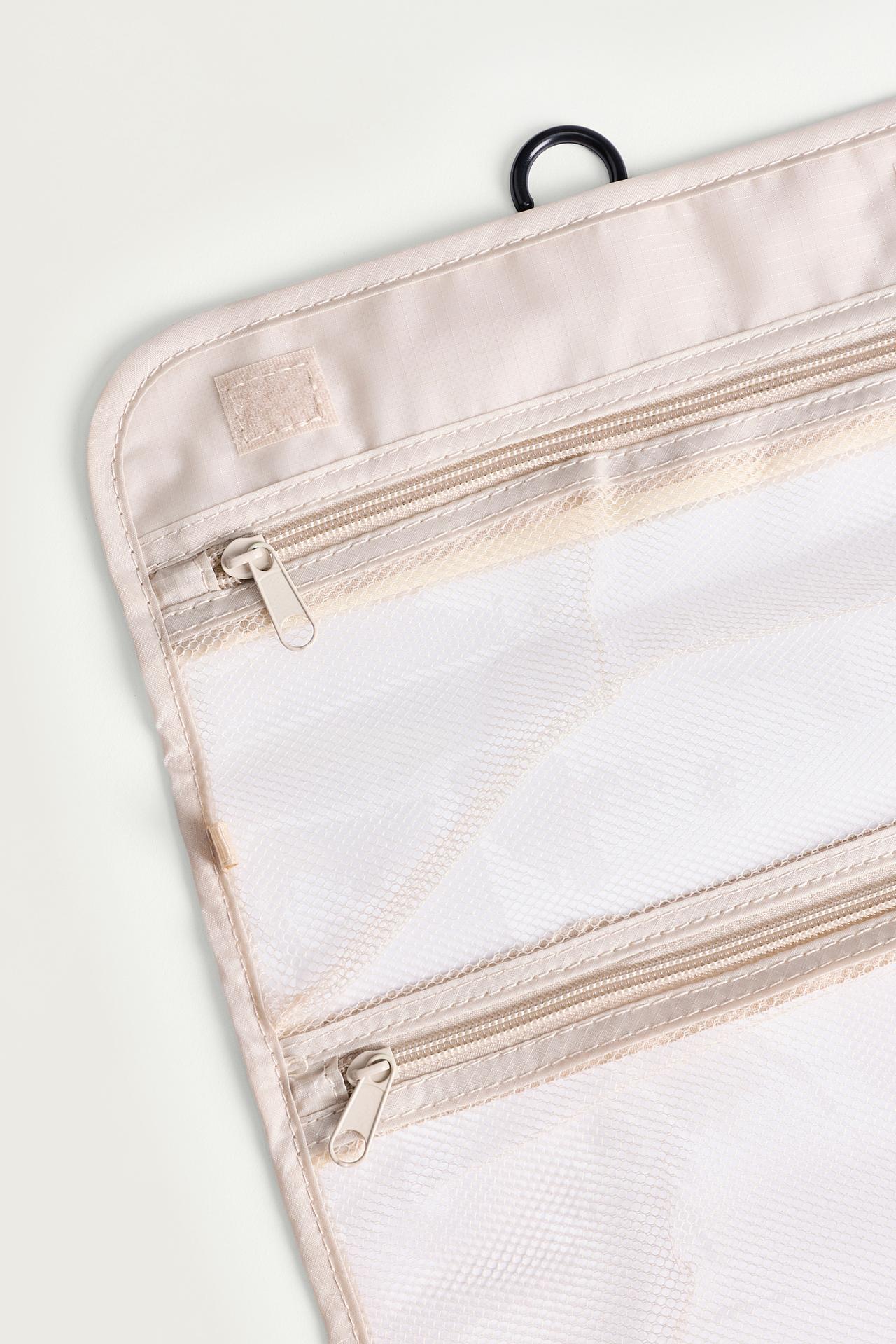 Foldable travel toiletry bag — ECRU