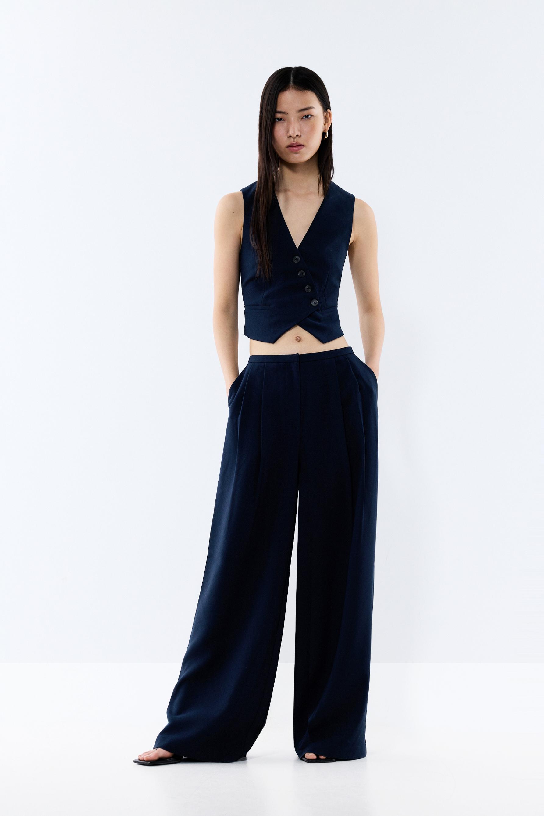 Pantalón recto pliegues