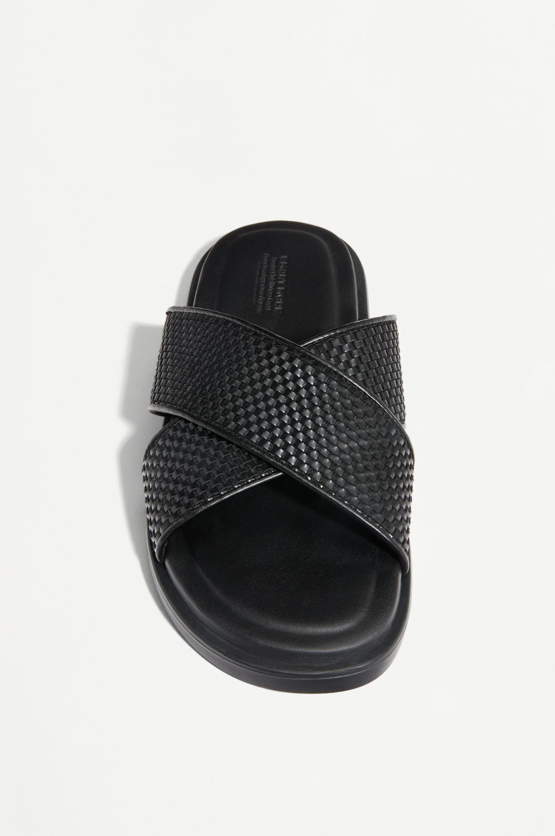 Crossed braided strap sandals — BLACK
