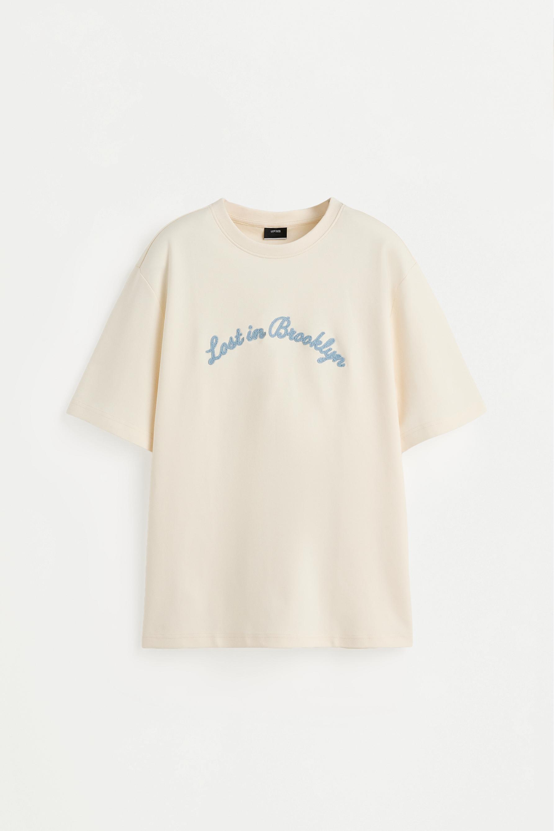 Embroidered interlock T-shirt — BUTTER