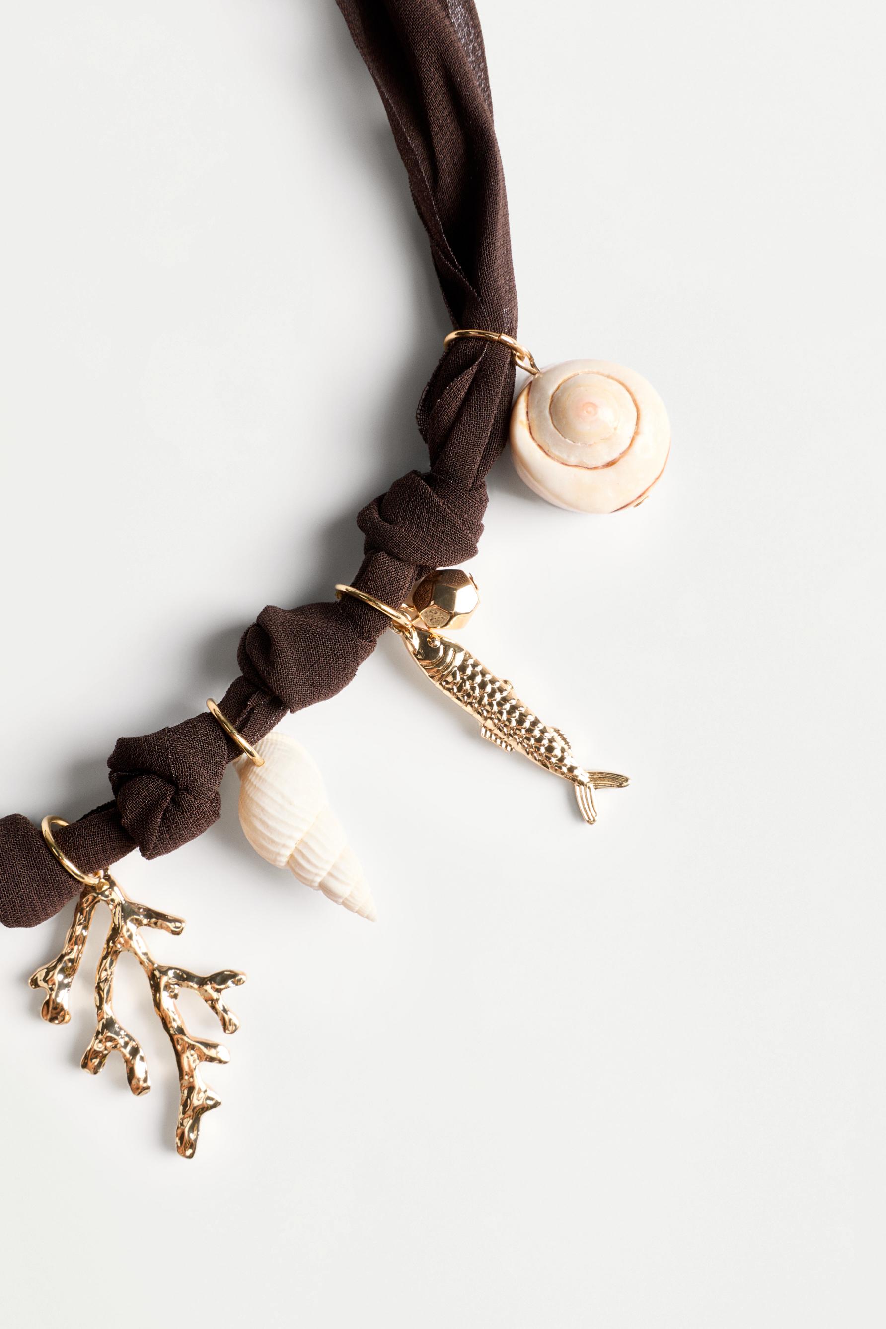 Multi-charm necklace — BROWN