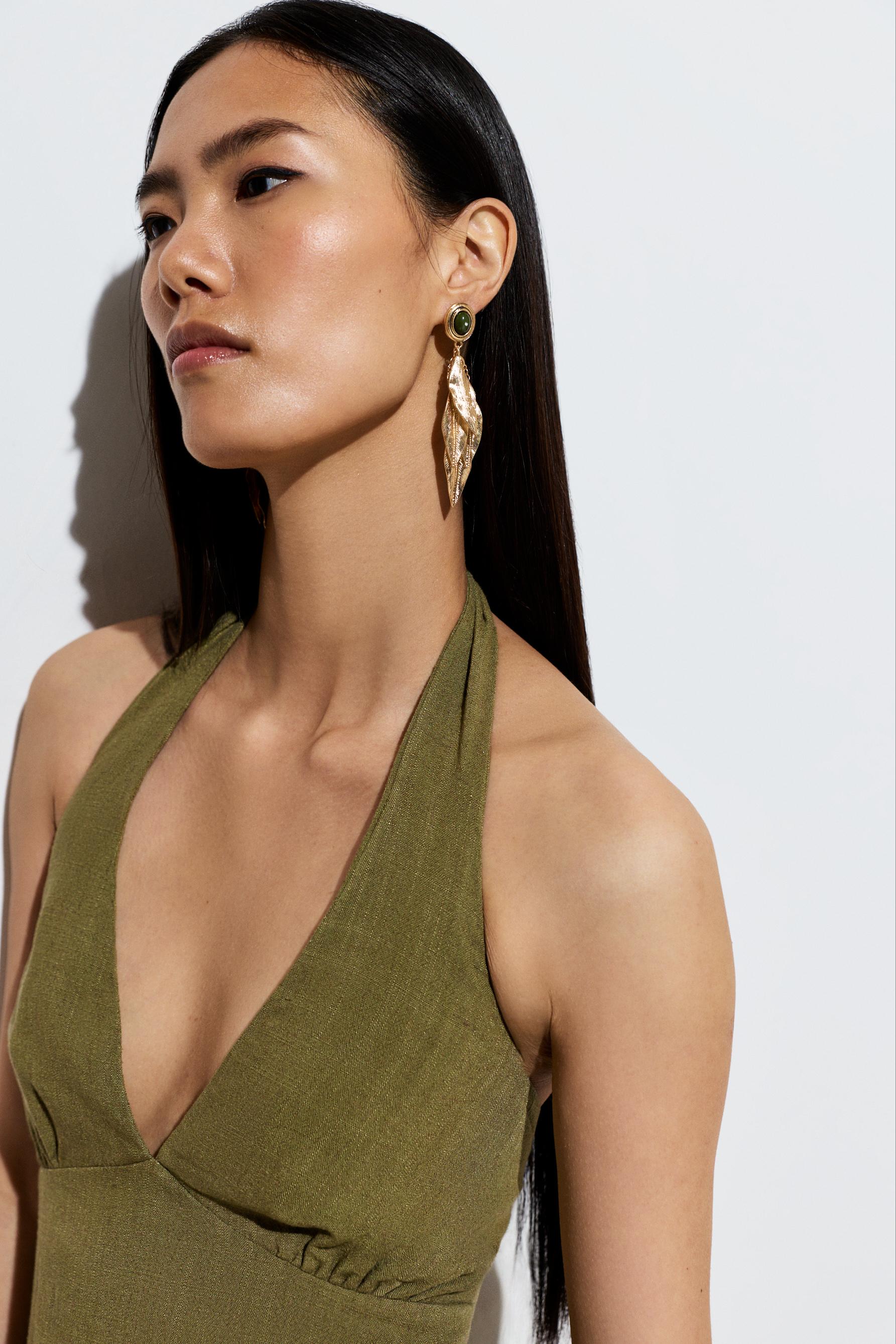 Gold feather earrings — GOLD