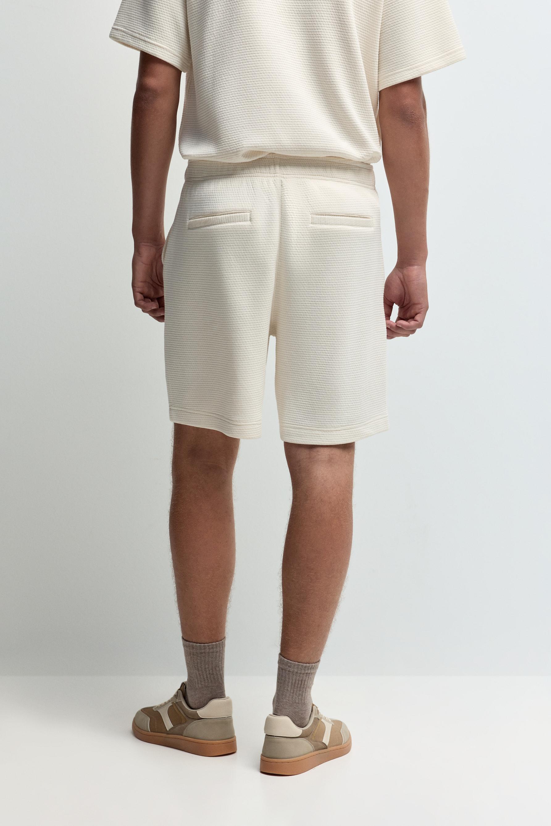 Waffle-textured Bermuda shorts — ECRU