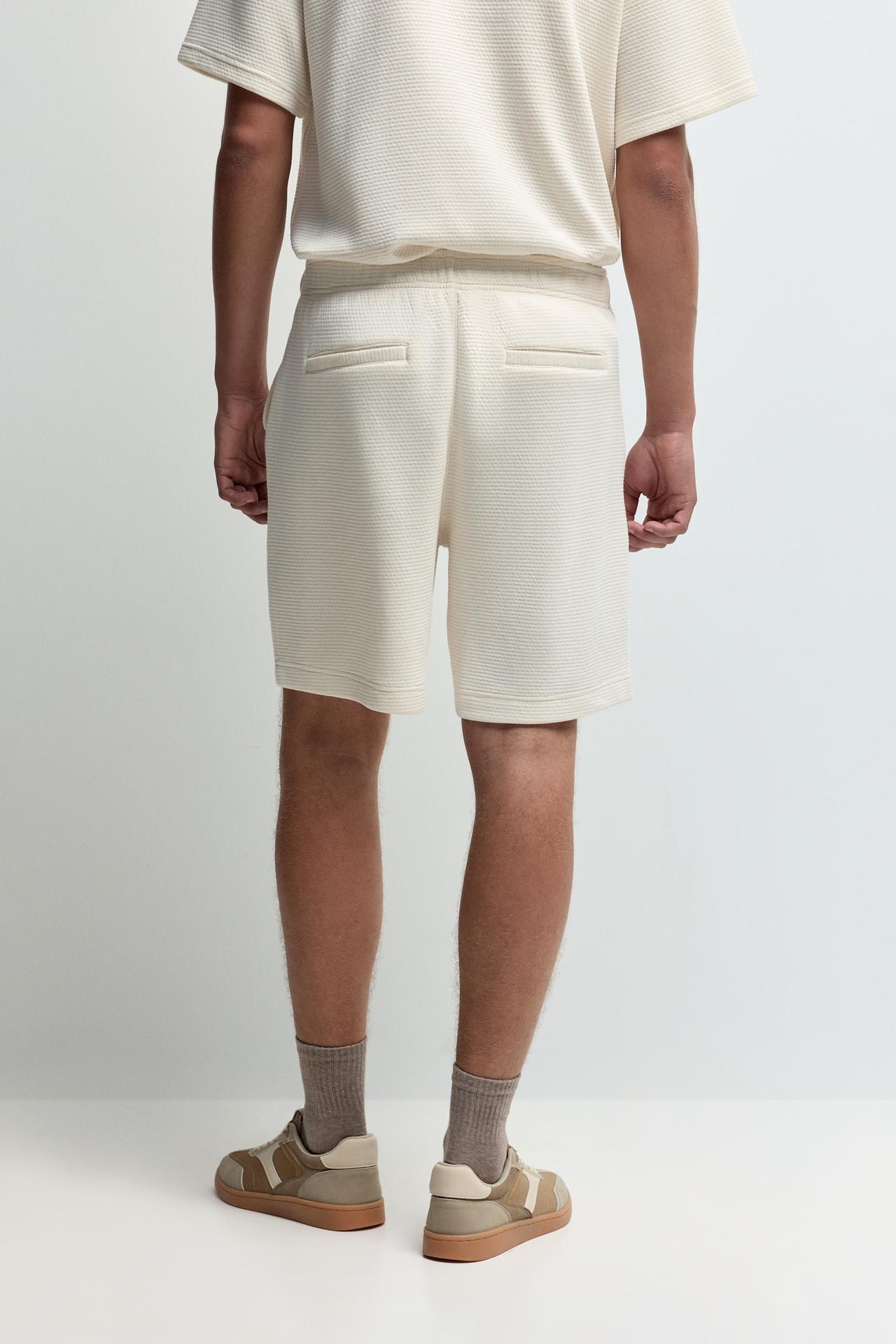Waffle-textured Bermuda shorts — ECRU