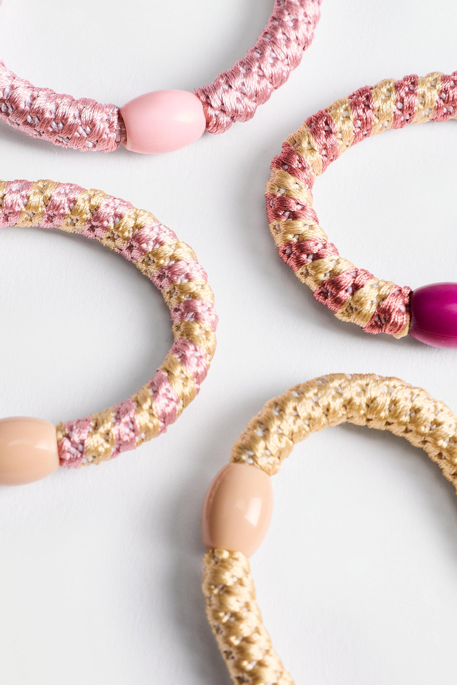 Coloured hair ties — VARIOUS