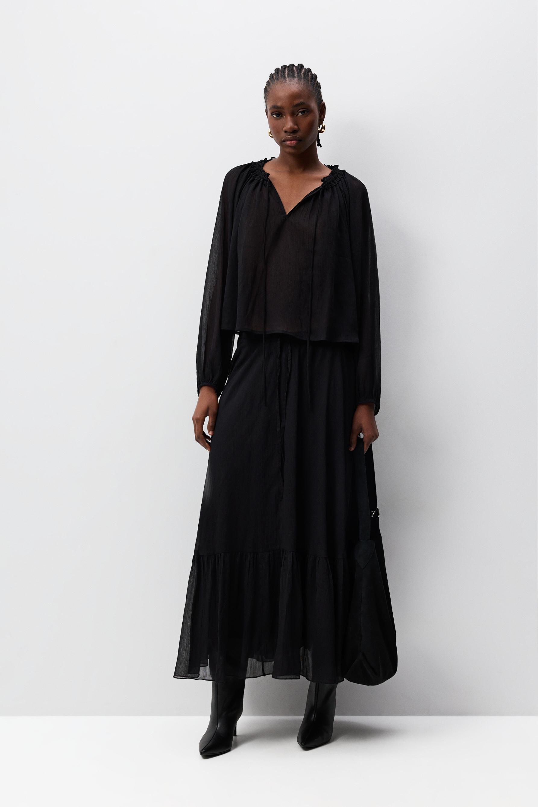 Falda midi semitransparente