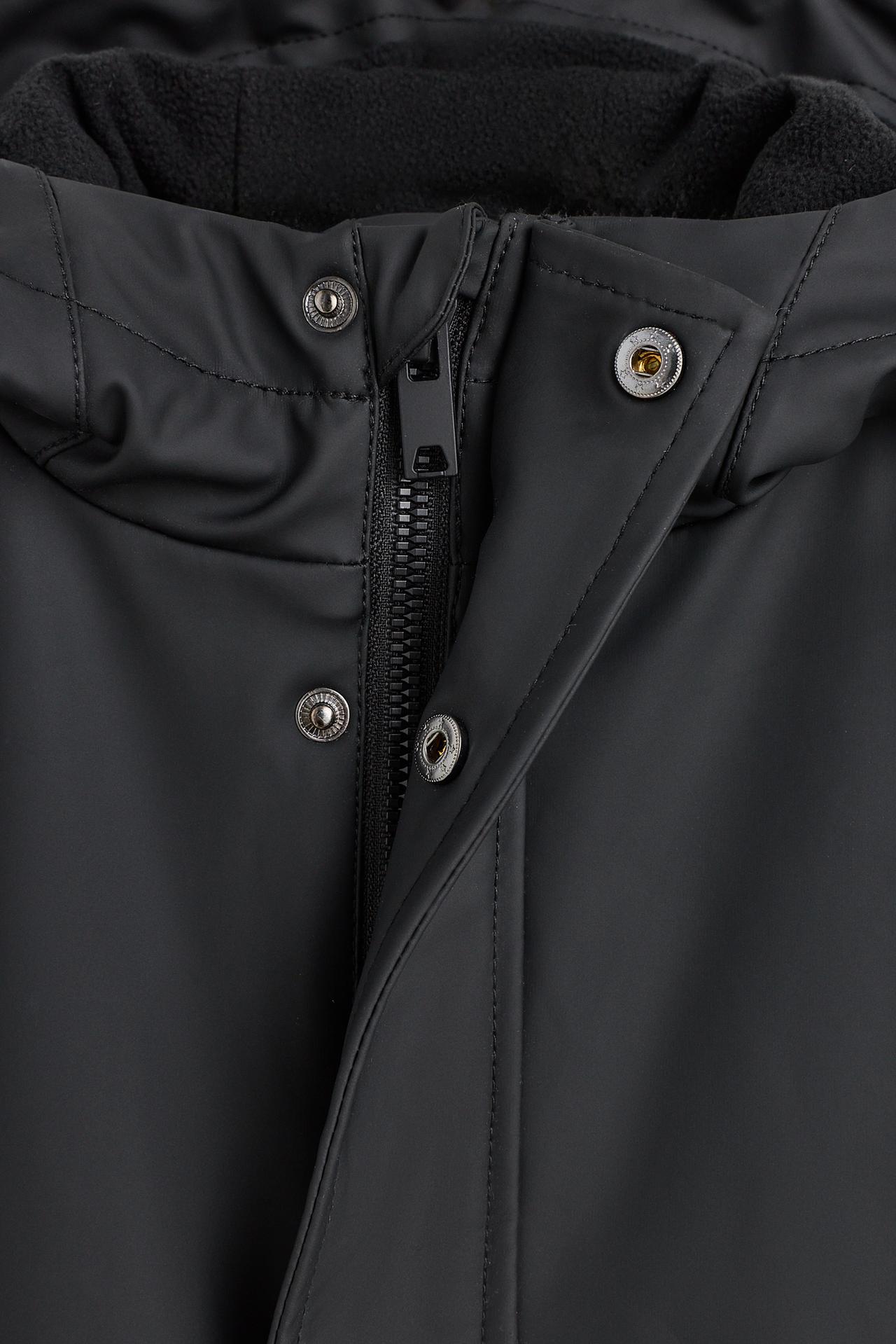 Long rubberised parka — BLACK