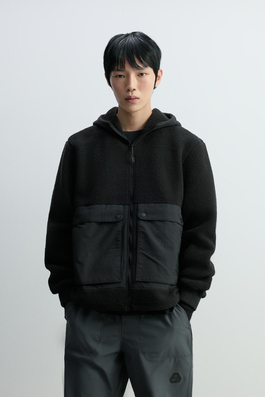 Casaco efeito de pelo encaracolado com bolsos