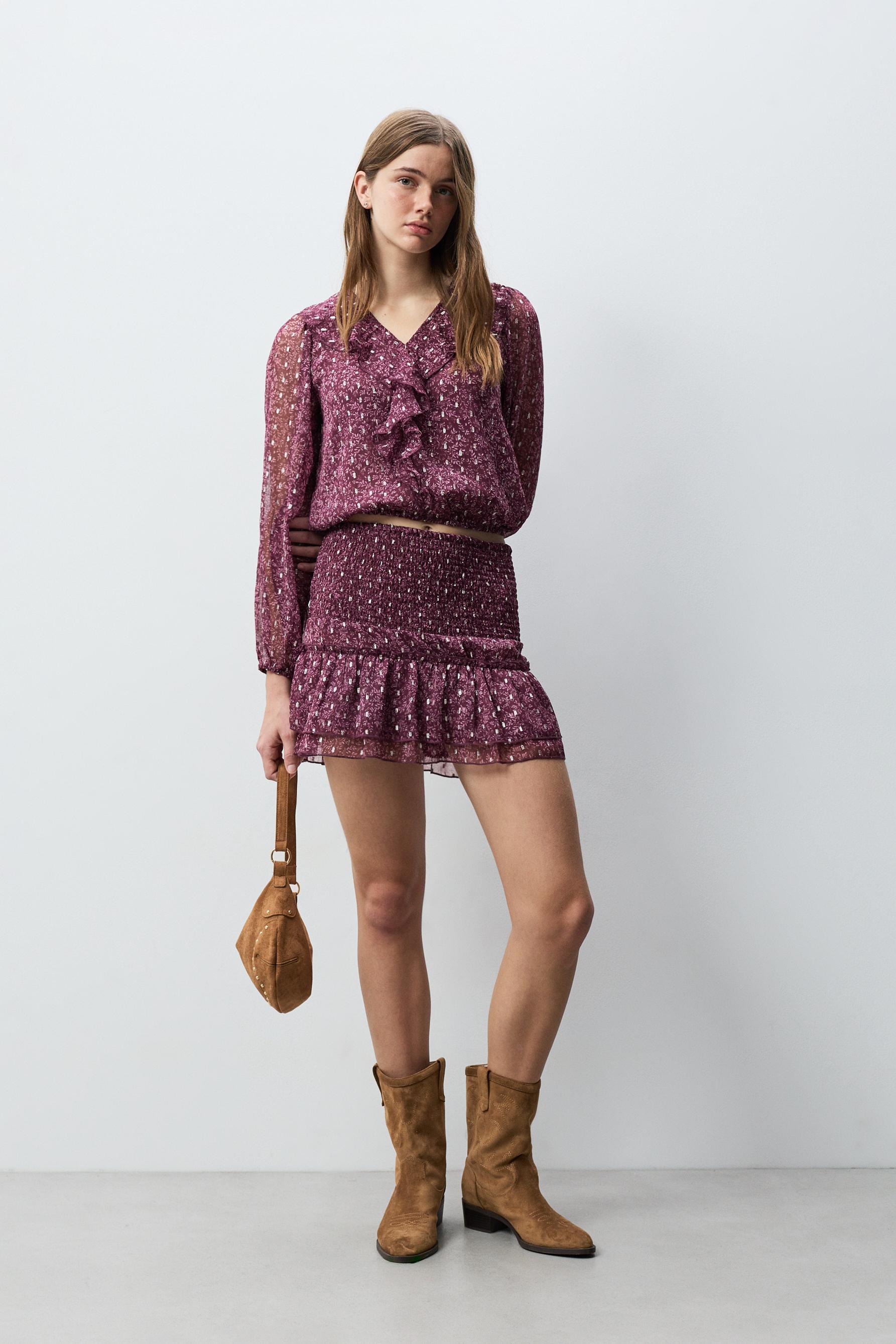 Blusa detalles metalizados