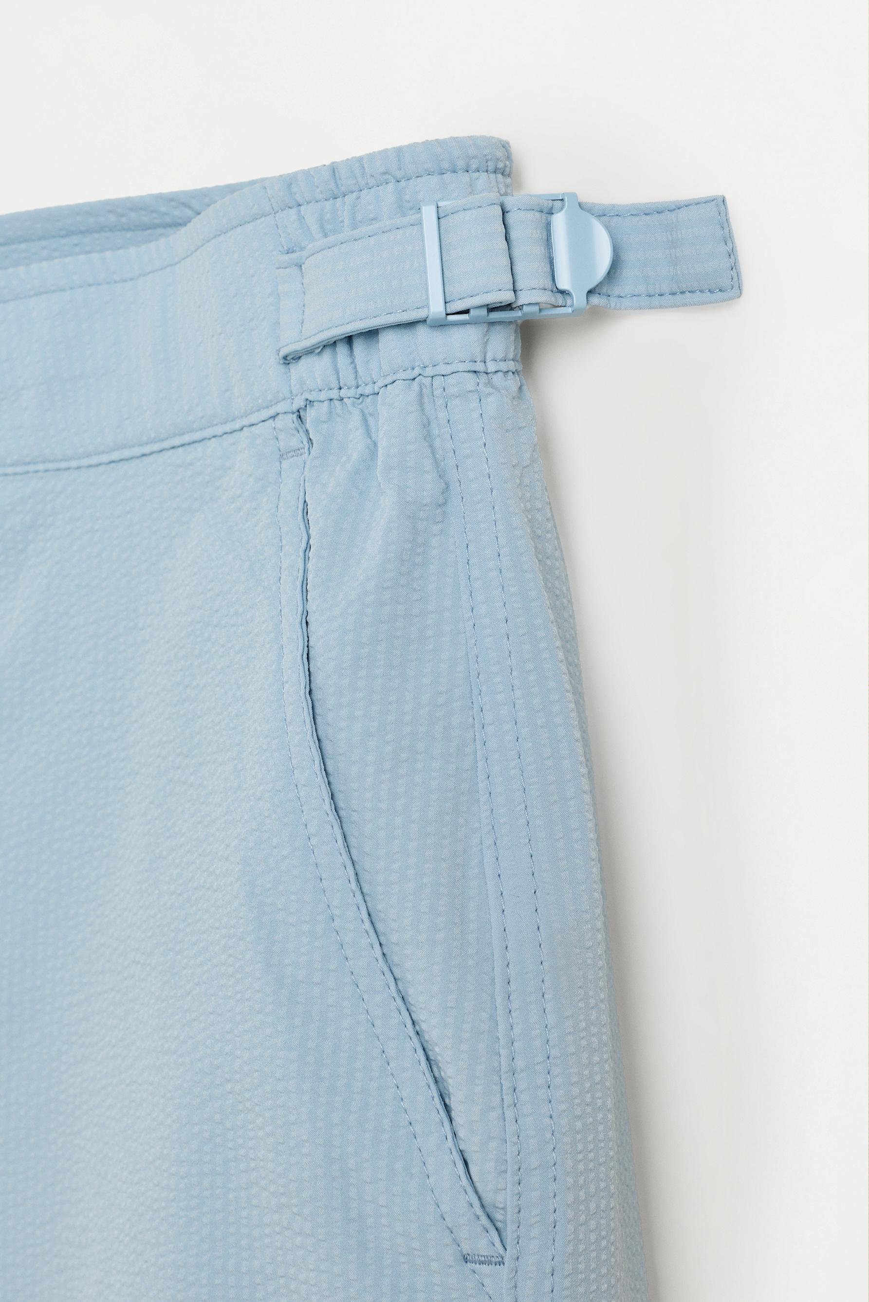 Short swim trunks with buckles — SKY BLUE