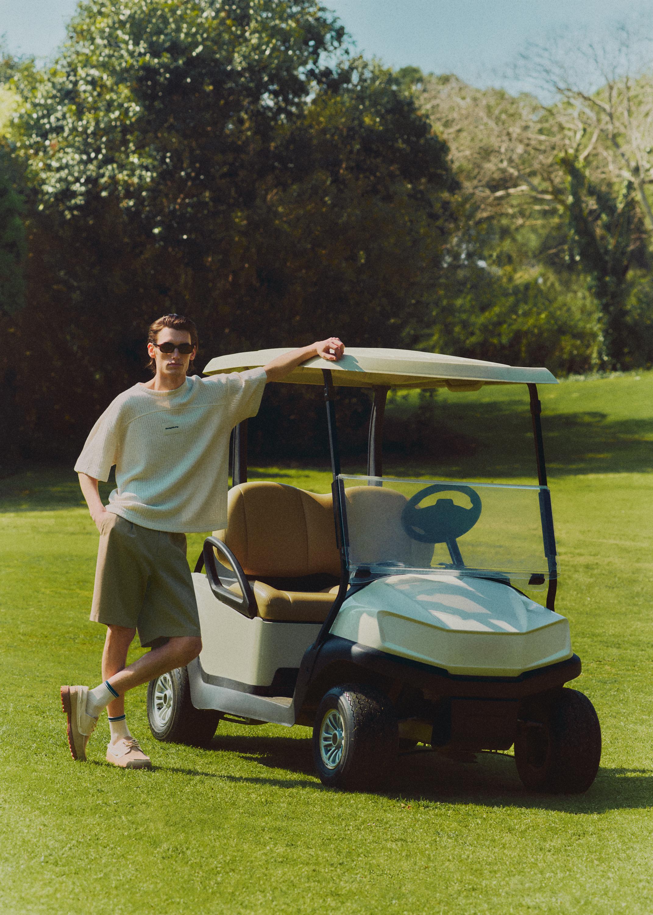 Pleated chino Bermuda shorts — SAND