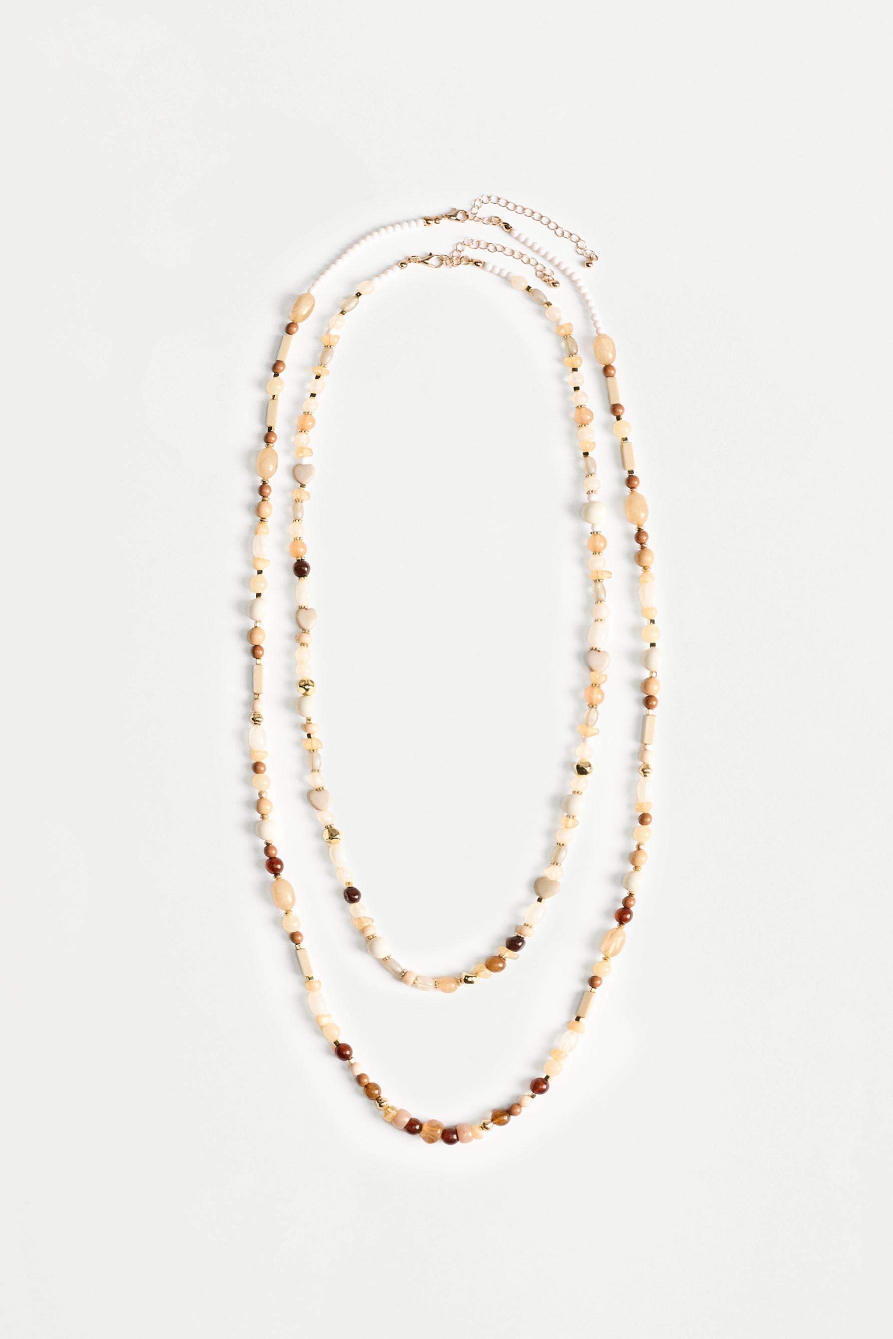 Double-strand long beaded necklace — VARIOUS