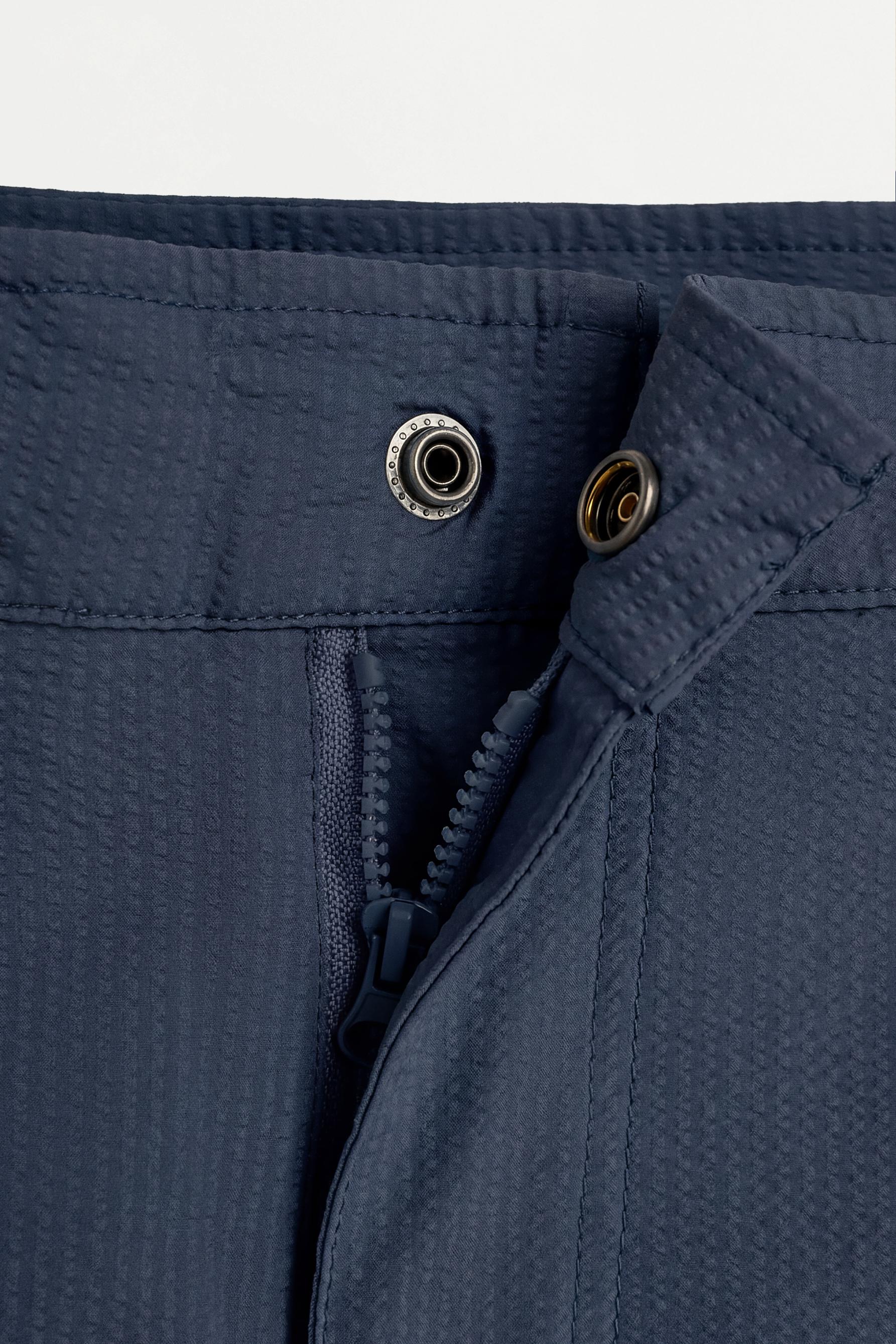 Short swim trunks with buckles — NAVY