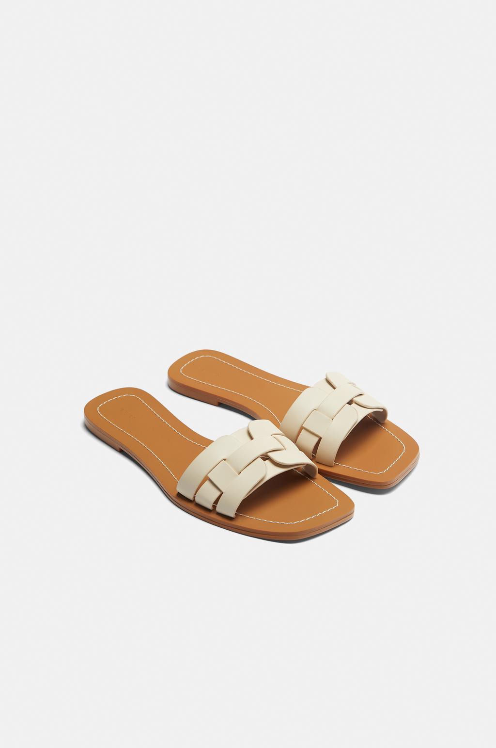 Flat sandals with interwoven detail