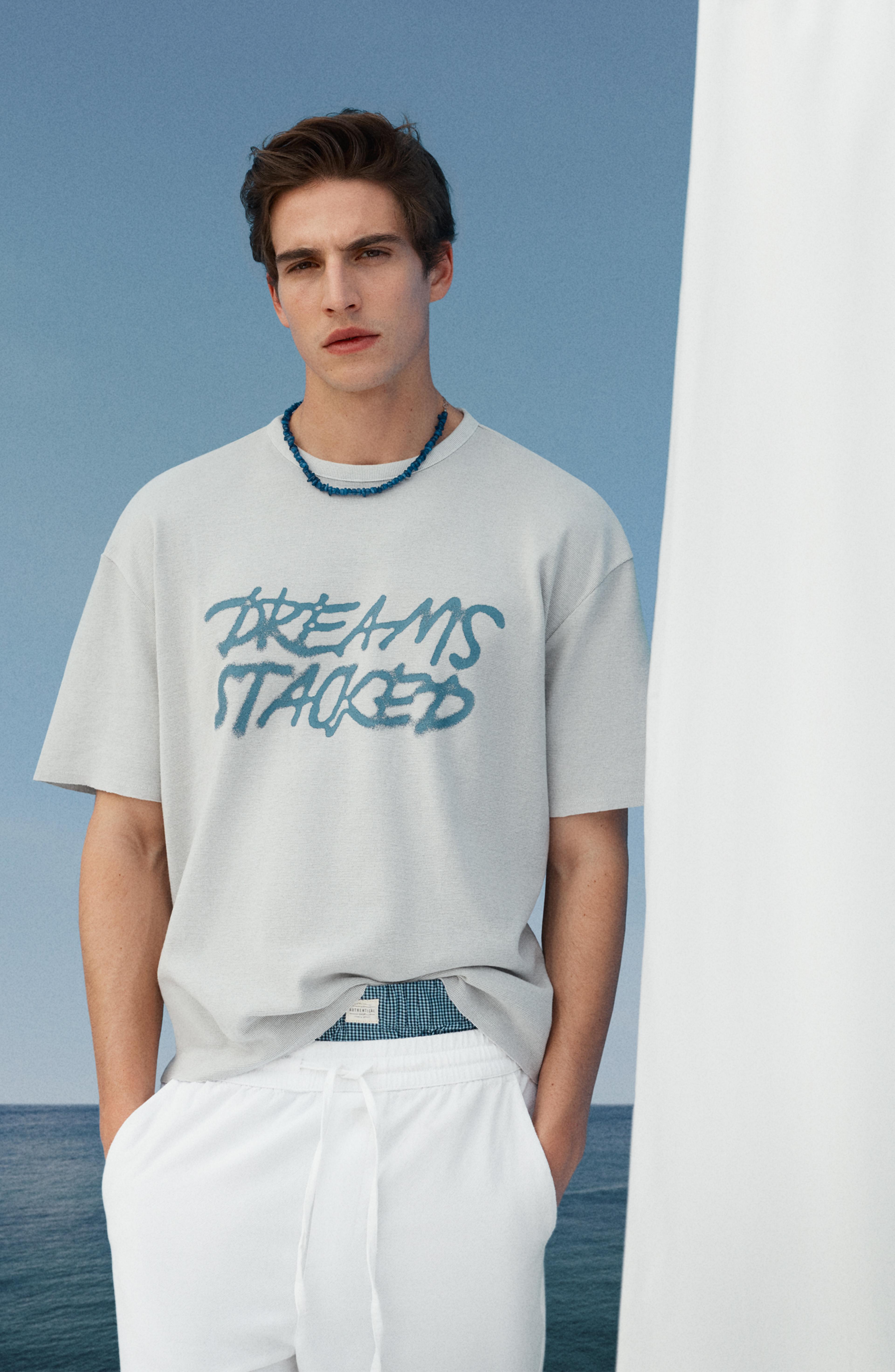 Faded-effect slogan T-shirt — STEEL