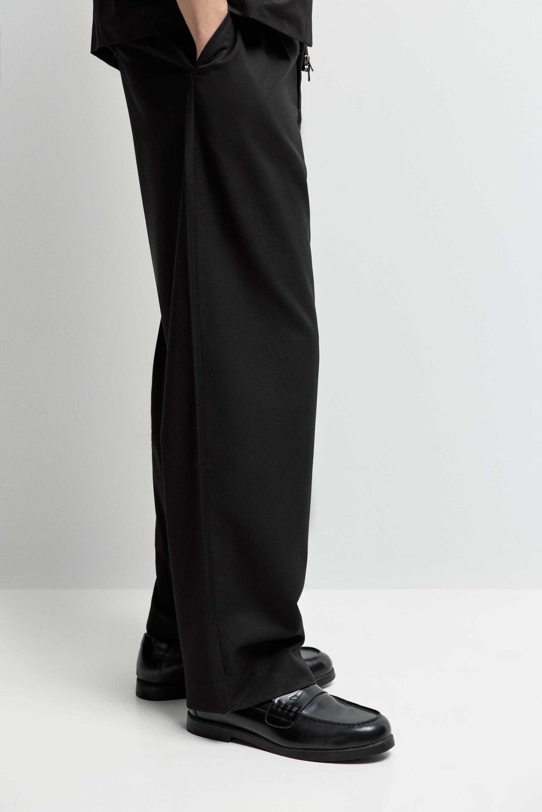 Baggy trousers with darts — BLACK