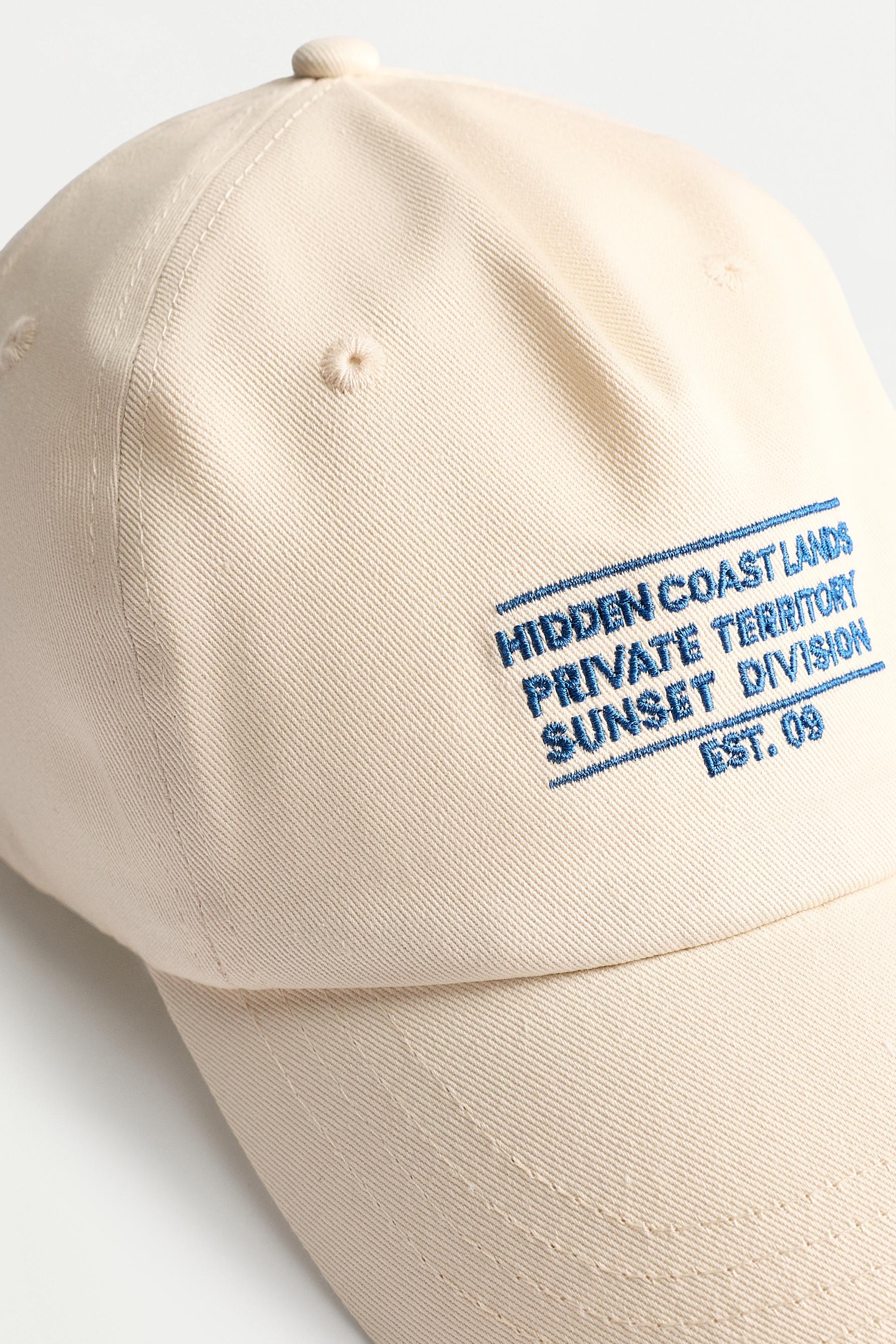 Slogan embroidered cap — ECRU