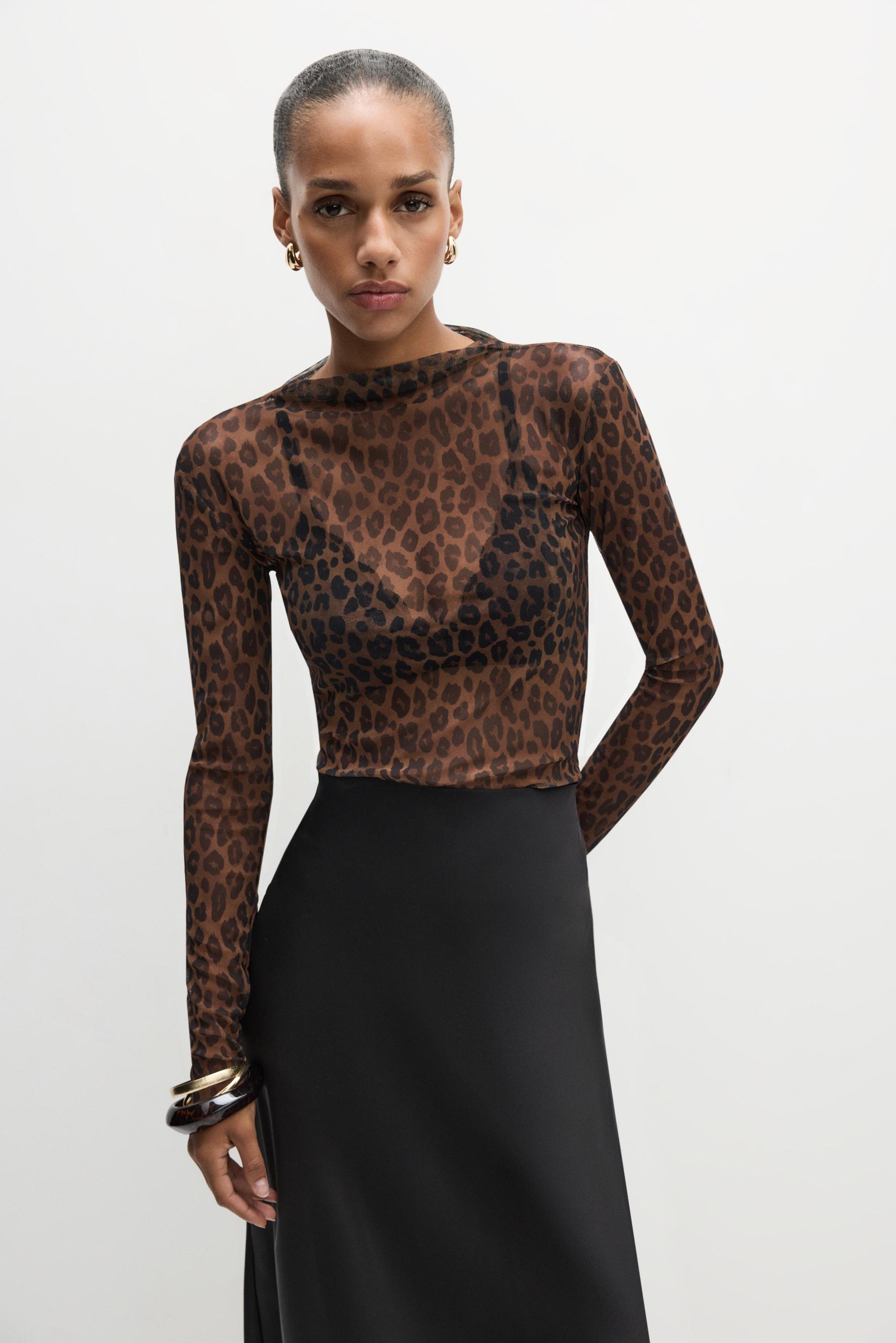 Top semitransparente manga larga